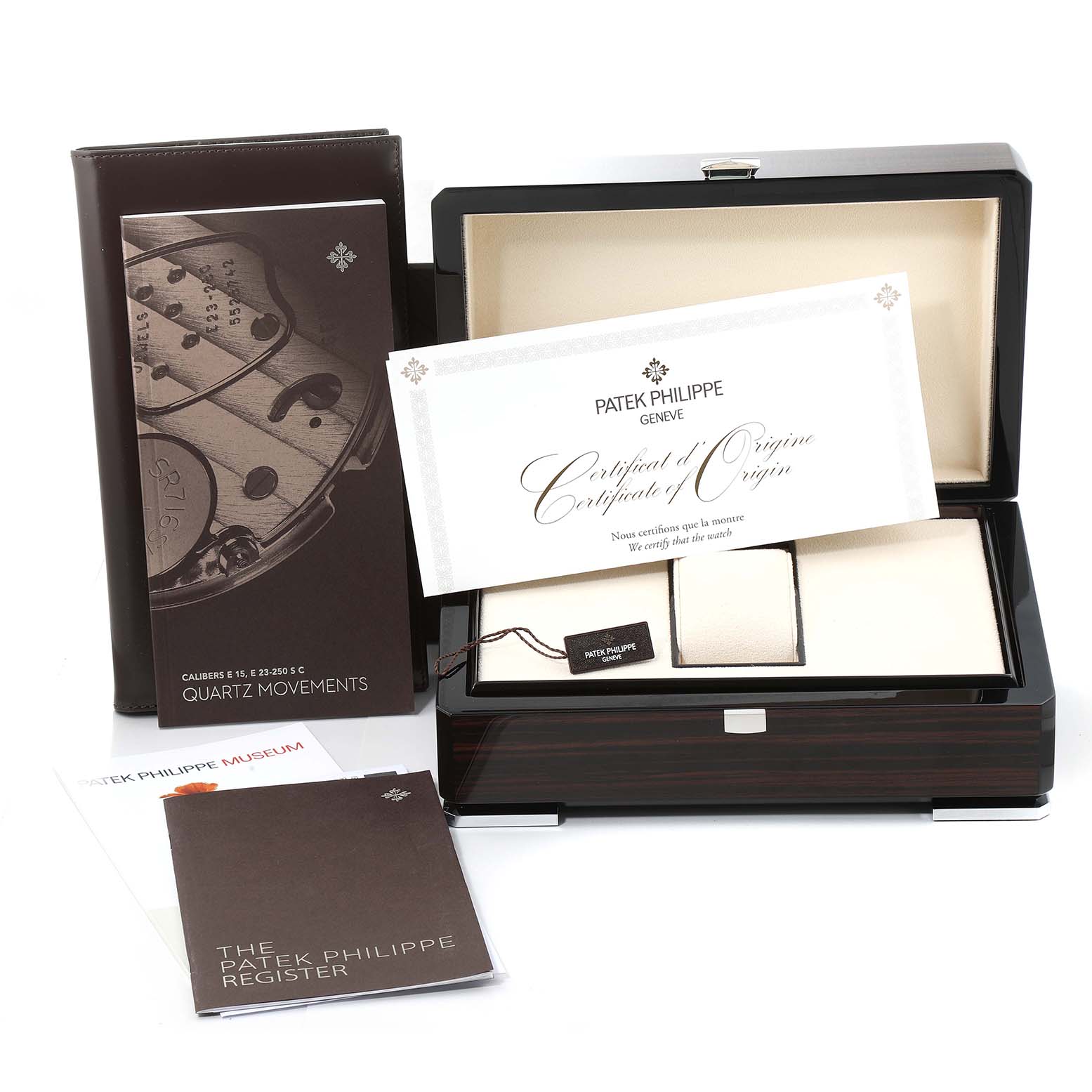 The image shows the packaging, certificate, manuals, and accessories of a Patek Philippe Aquanaut 5267/200A - 011 Men's Stainless Steel Green Dial 5267/200A - 011 Men's Stainless Steel Green Dial watch.