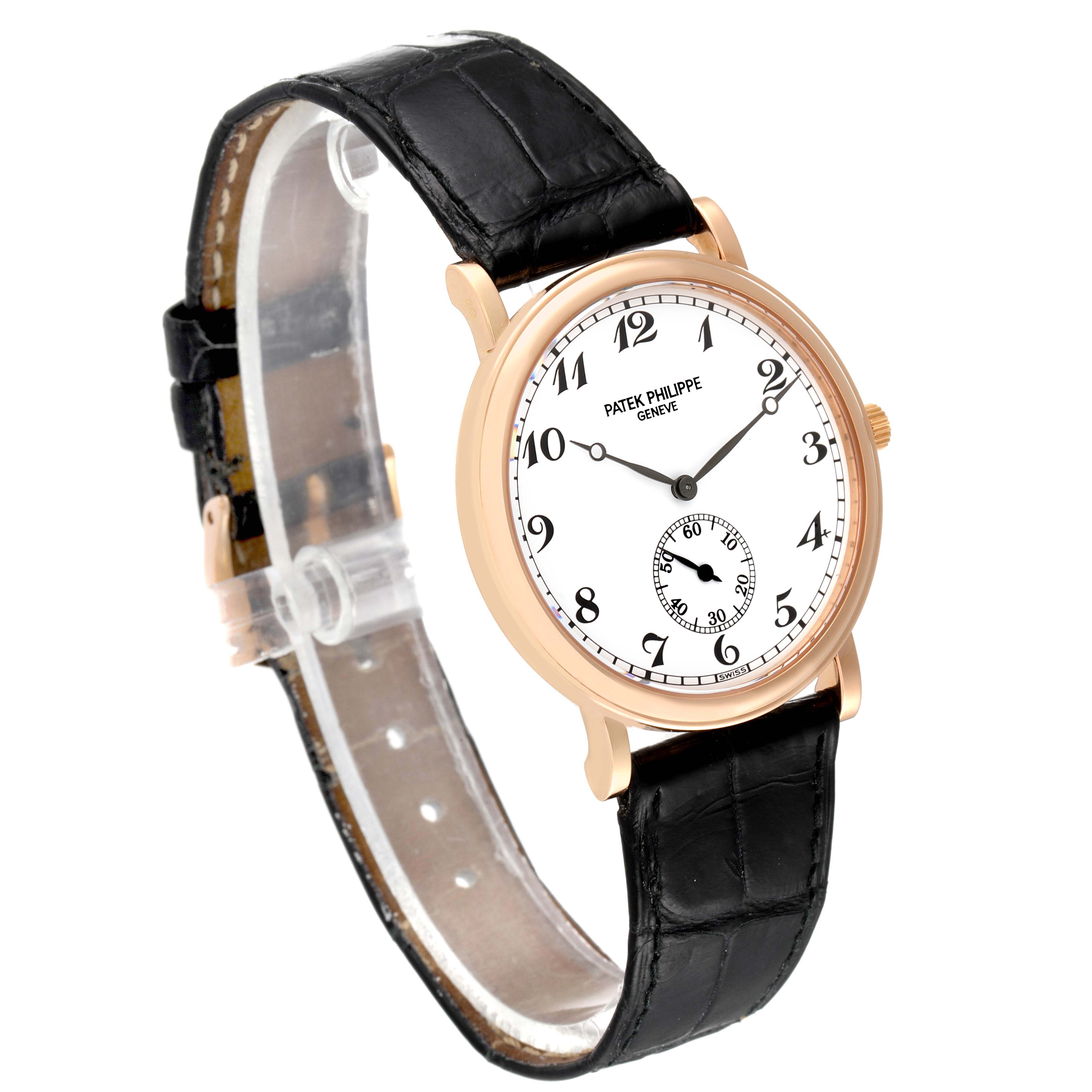 The image shows a side-view angle of a Patek Philippe Calatrava 5022R Men's Rose Gold White Dial 5022R Men's Rose Gold White Dial watch, featuring a black leather strap and a white dial with Arabic numerals.