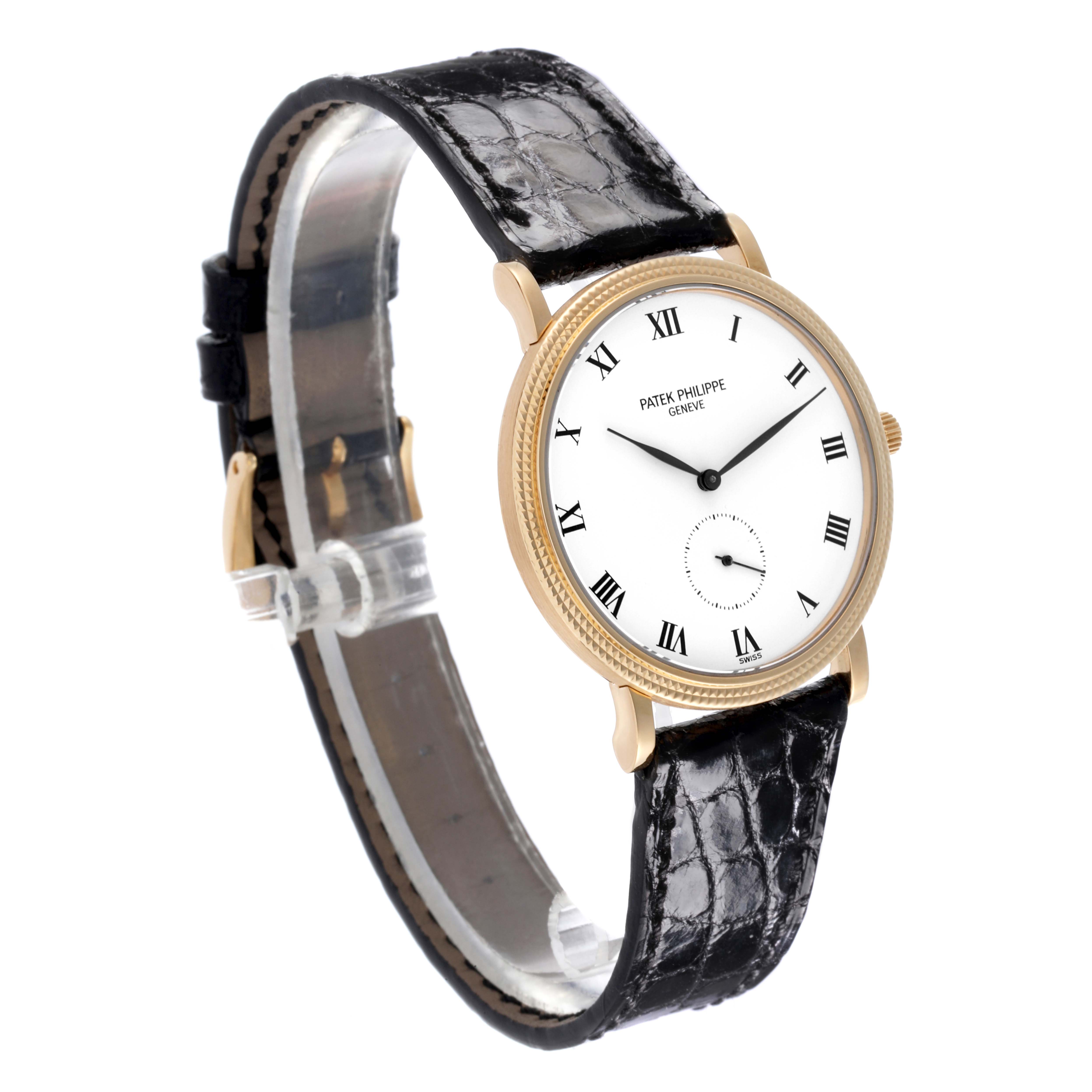 The Patek Philippe Calatrava 3919J Men's Yellow Gold White Dial 3919J Men's Yellow Gold White Dial watch is shown at a slight side angle, highlighting the face, bezel, and leather strap.