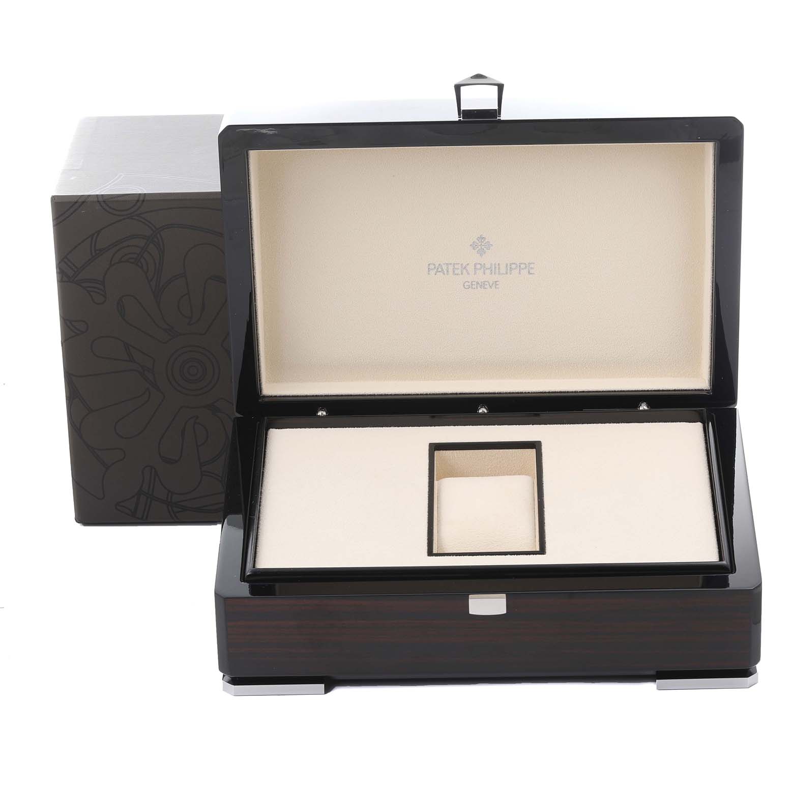 The image shows the open box of a Patek Philippe Complications 5040G Men's White Gold Silver Dial 5040G Men's White Gold Silver Dial watch, highlighting the interior and exterior design.