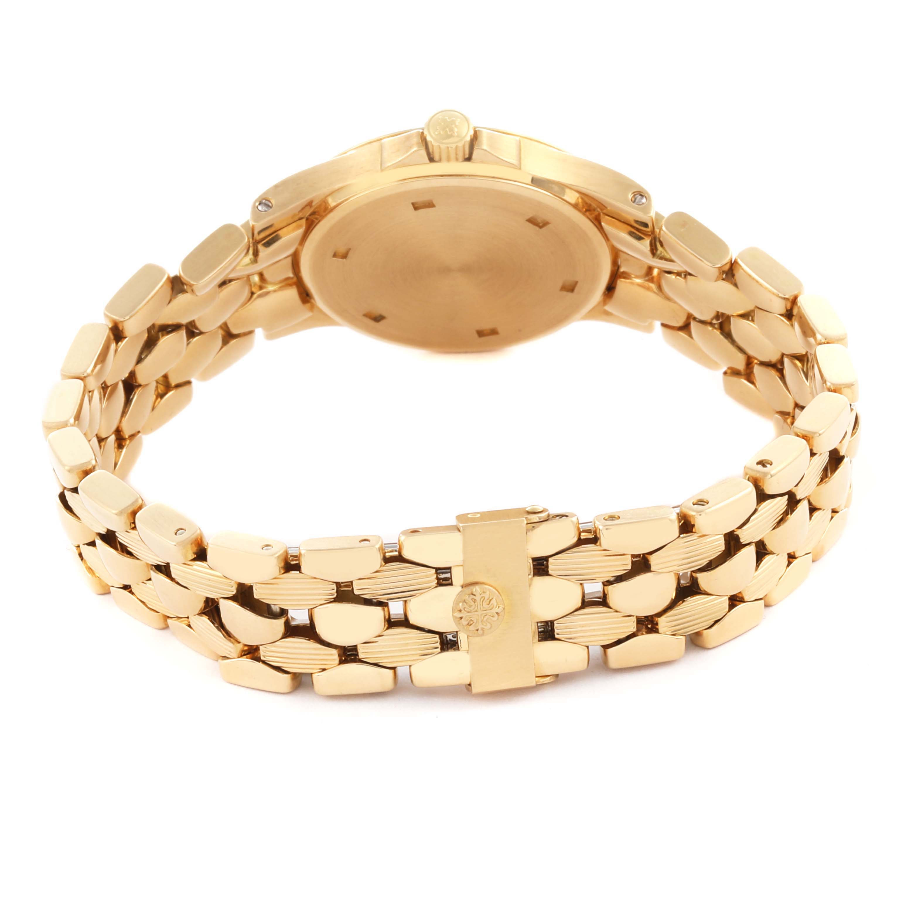 The Patek Philippe Neptune 4881/1J-001 Women's Yellow Gold Silver Dial 4881/1J-001 Women's Yellow Gold Silver Dial watch is shown from the back, highlighting the bracelet and case back.