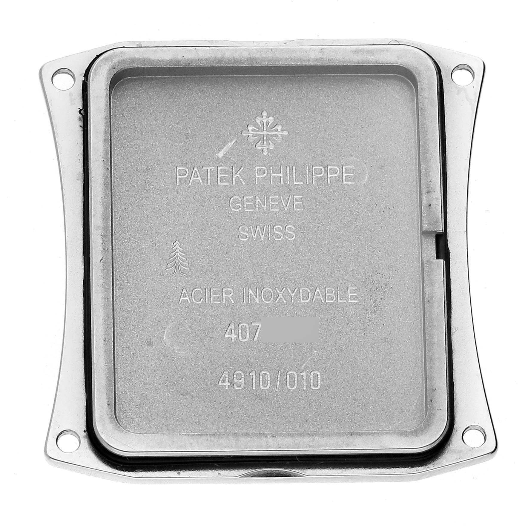 The image shows the back case of a Patek Philippe Twenty-4 4910/10A-011 Women's Stainless Steel Silver Dial 4910/10A-011 Women's Stainless Steel Silver Dial watch, displaying inscriptions and material details.