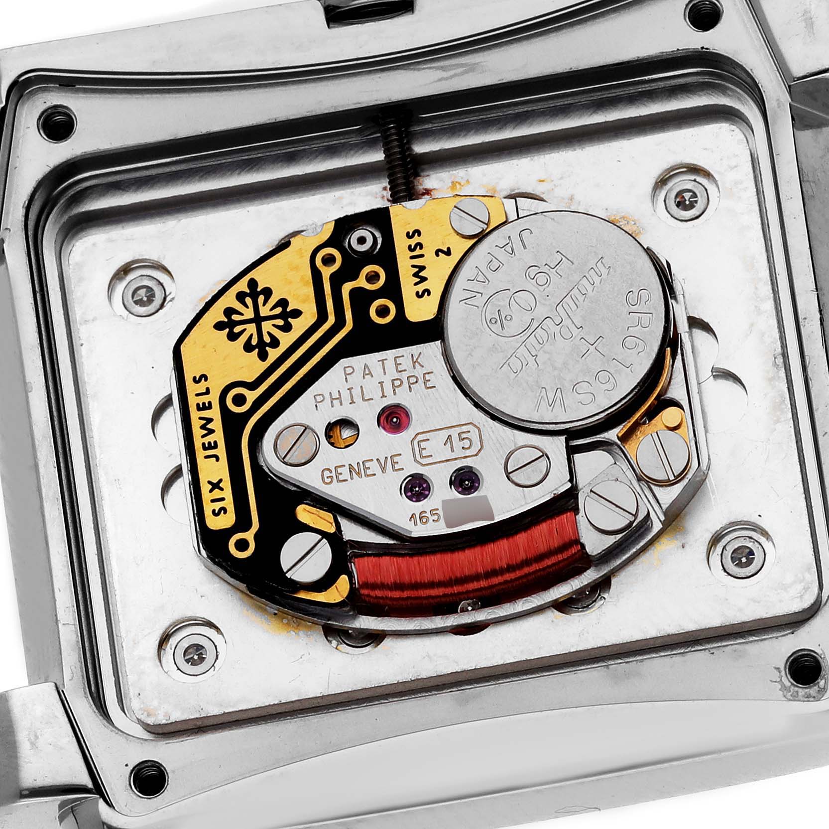 The image shows the back view of the Patek Philippe Twenty-4 4910/10A-011 Women's Stainless Steel Silver Dial 4910/10A-011 Women's Stainless Steel Silver Dial watch, displaying its internal battery and movement components.