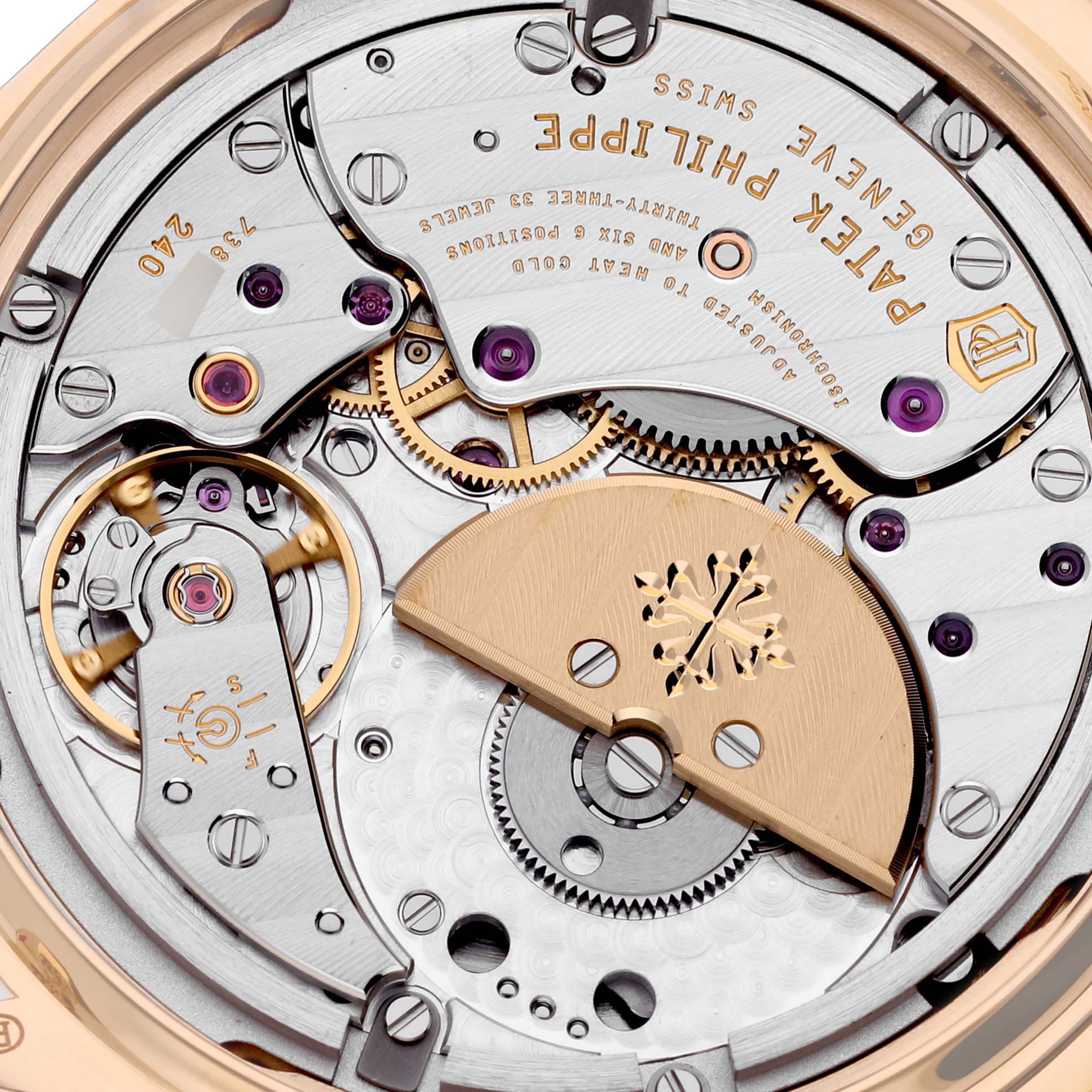 The image shows the detailed movement and mechanics of the Patek Philippe Complications 7130R-013 Men's Rose Gold Silver Dial 7130R-013 Men's Rose Gold Silver Dial watch from a close-up angle.