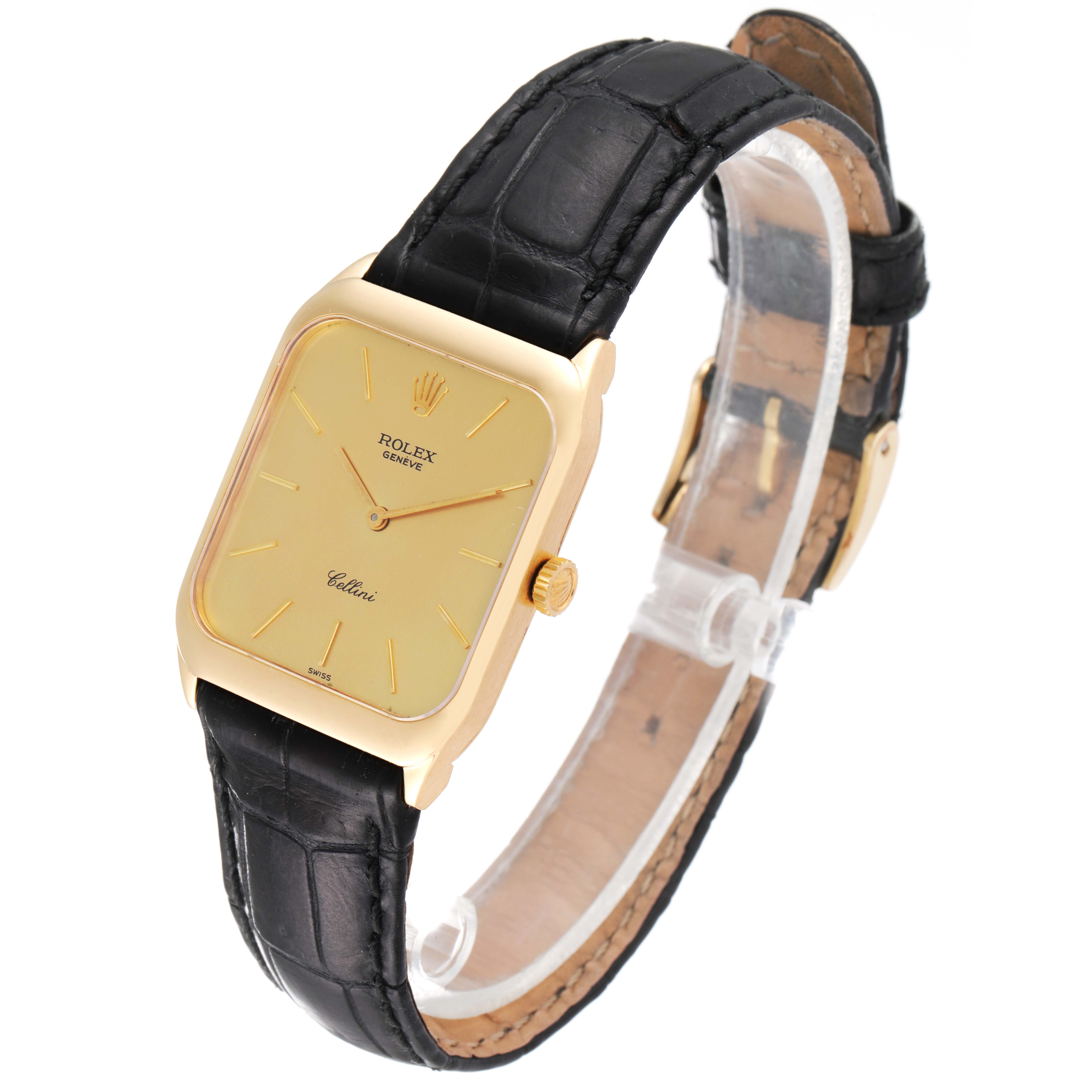 The image shows a Rolex Cellini 4135 Men's Yellow Gold Champagne Dial 4135 Men's Yellow Gold Champagne Dial watch with a gold rectangular face and black leather strap at a three-quarter angle.