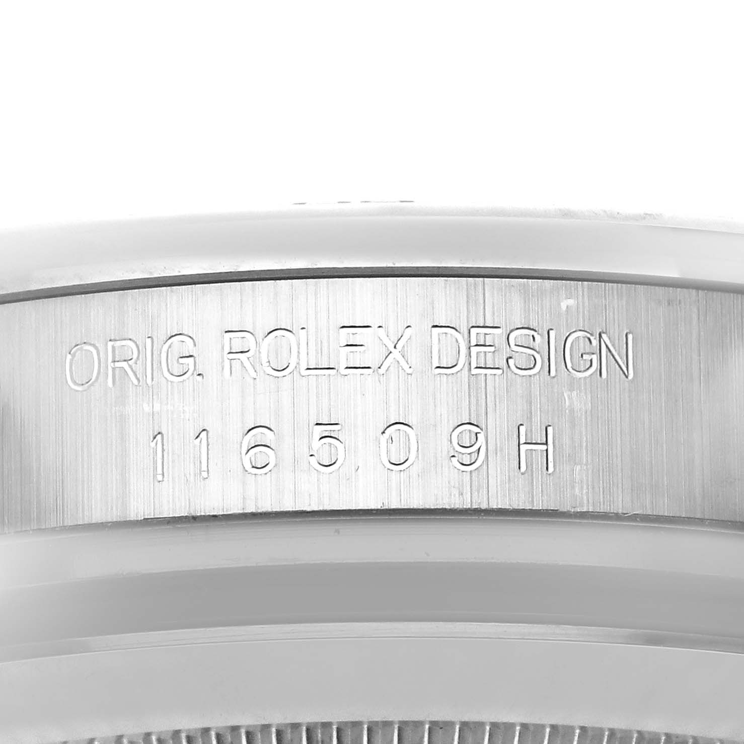 The image shows a close-up side view of the engraved bezel on a Rolex Daytona 116509 Men's White Gold Mother of Pearl Dial 116509 Men's White Gold Mother of Pearl Dial watch, displaying the design number.