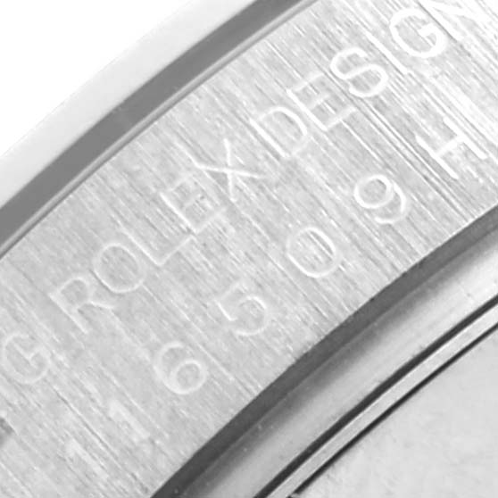 The image shows a close-up of the Rolex Daytona 116509 Men
s White Gold Mother of Pearl Dial 116509 Men
s White Gold Mother of Pearl Dial
s engraved case back edge.