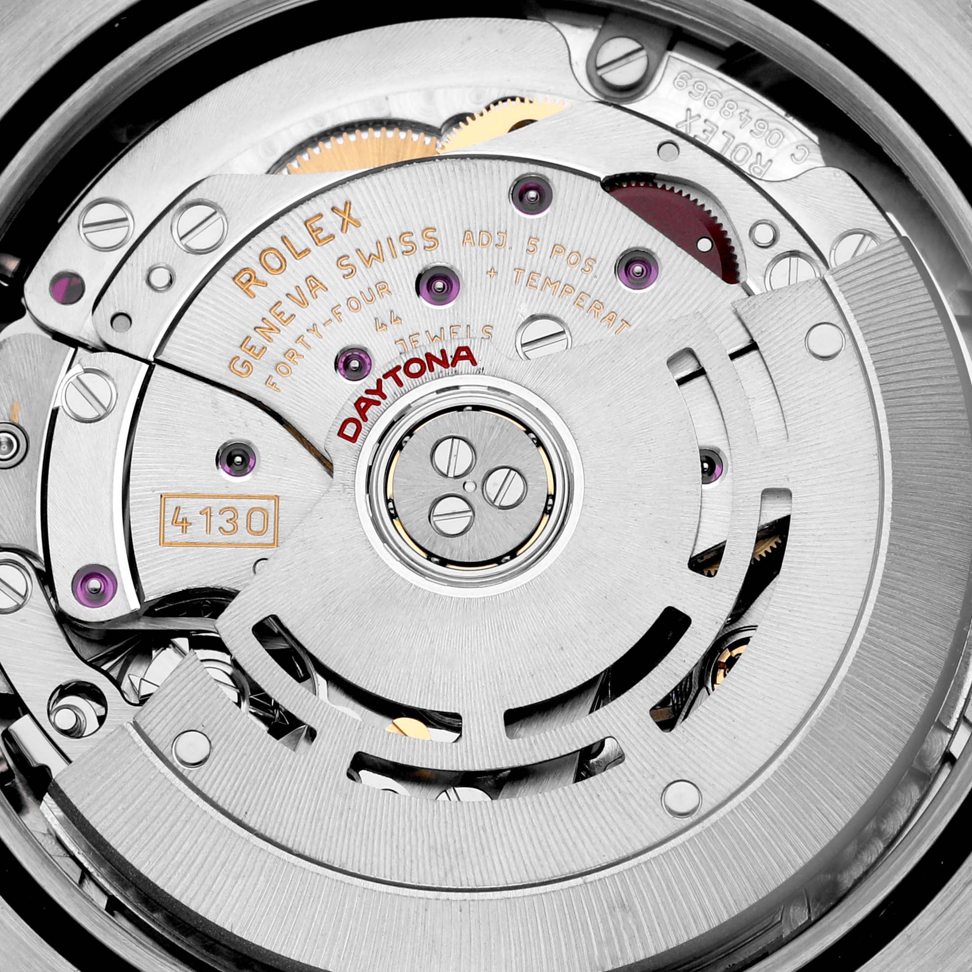 The image shows a close-up view of the movement mechanism inside a Rolex Daytona 116509 Men
s White Gold Mother of Pearl Dial 116509 Men
s White Gold Mother of Pearl Dial watch.