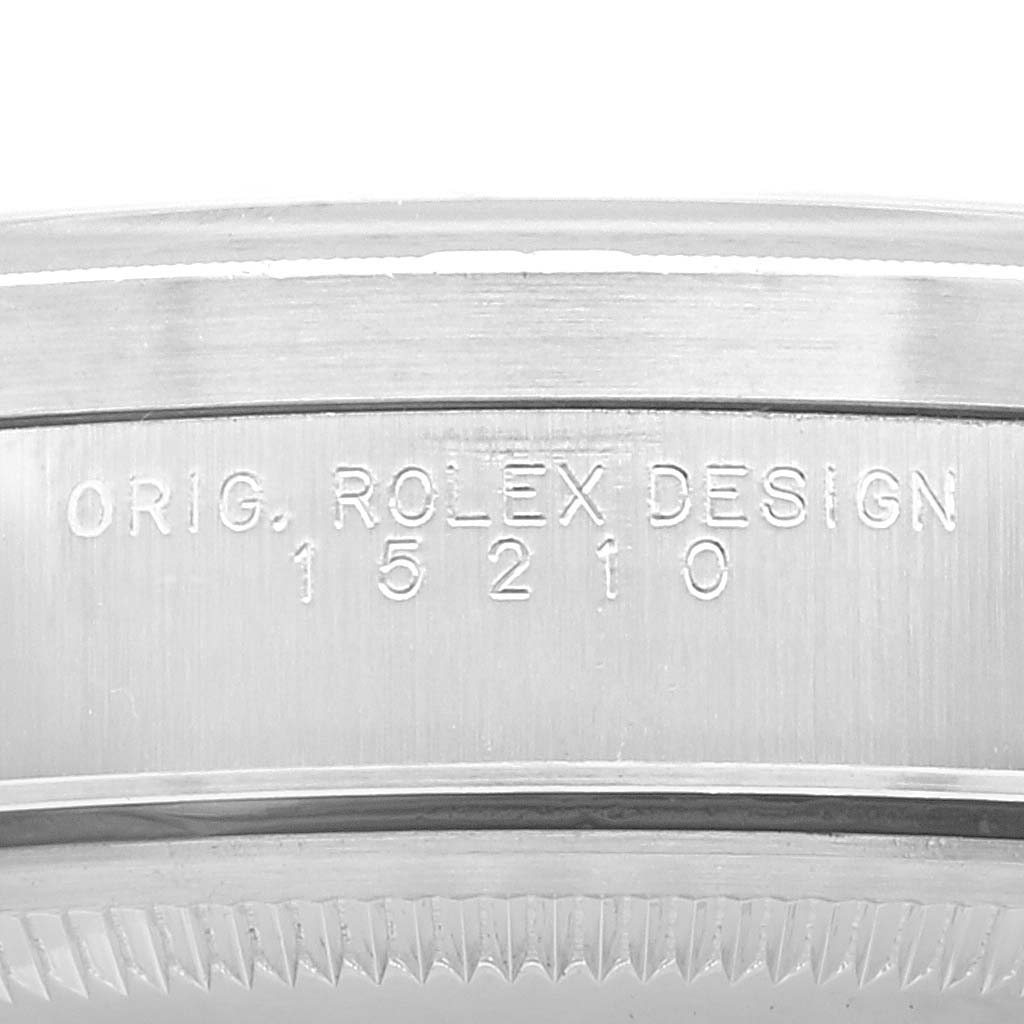 This image shows a close-up of the model number engraving on the case side of a Rolex Date 15210 Men
s Stainless Steel Black Dial 15210 Men
s Stainless Steel Black Dial watch.