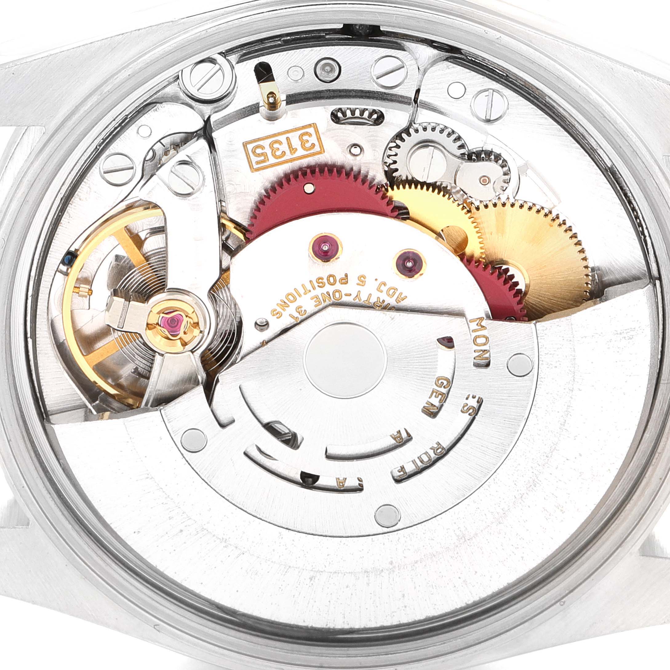 The image shows an angled view of the intricate internal movement of a Rolex Date 15200 Men's Stainless Steel White Dial 15200 Men's Stainless Steel White Dial model watch with visible gears and components.