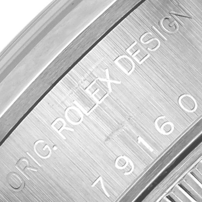 The image shows the engraved case side of a Rolex Date 79160 Women's Stainless Steel Silver Dial 79160 Women's Stainless Steel Silver Dial watch, focusing on the model number and "ROLEX DESIGN" text.