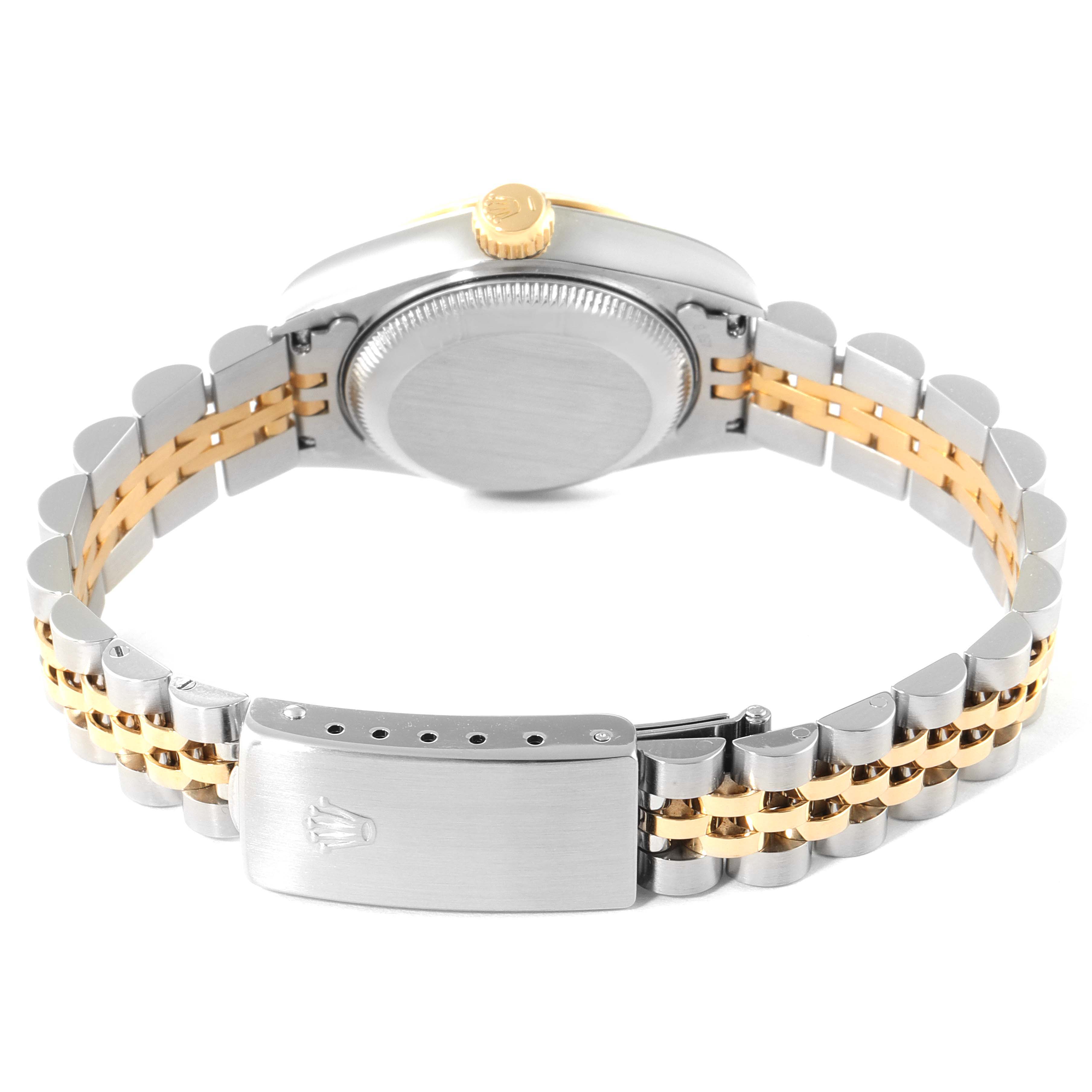 This image shows the back view of a Rolex Datejust 69173 Women
s Steel and Gold (two tone) Champagne Dial 69173 Women
s Steel and Gold (two tone) Champagne Dial watch, highlighting its clasp, bracelet, and case back.