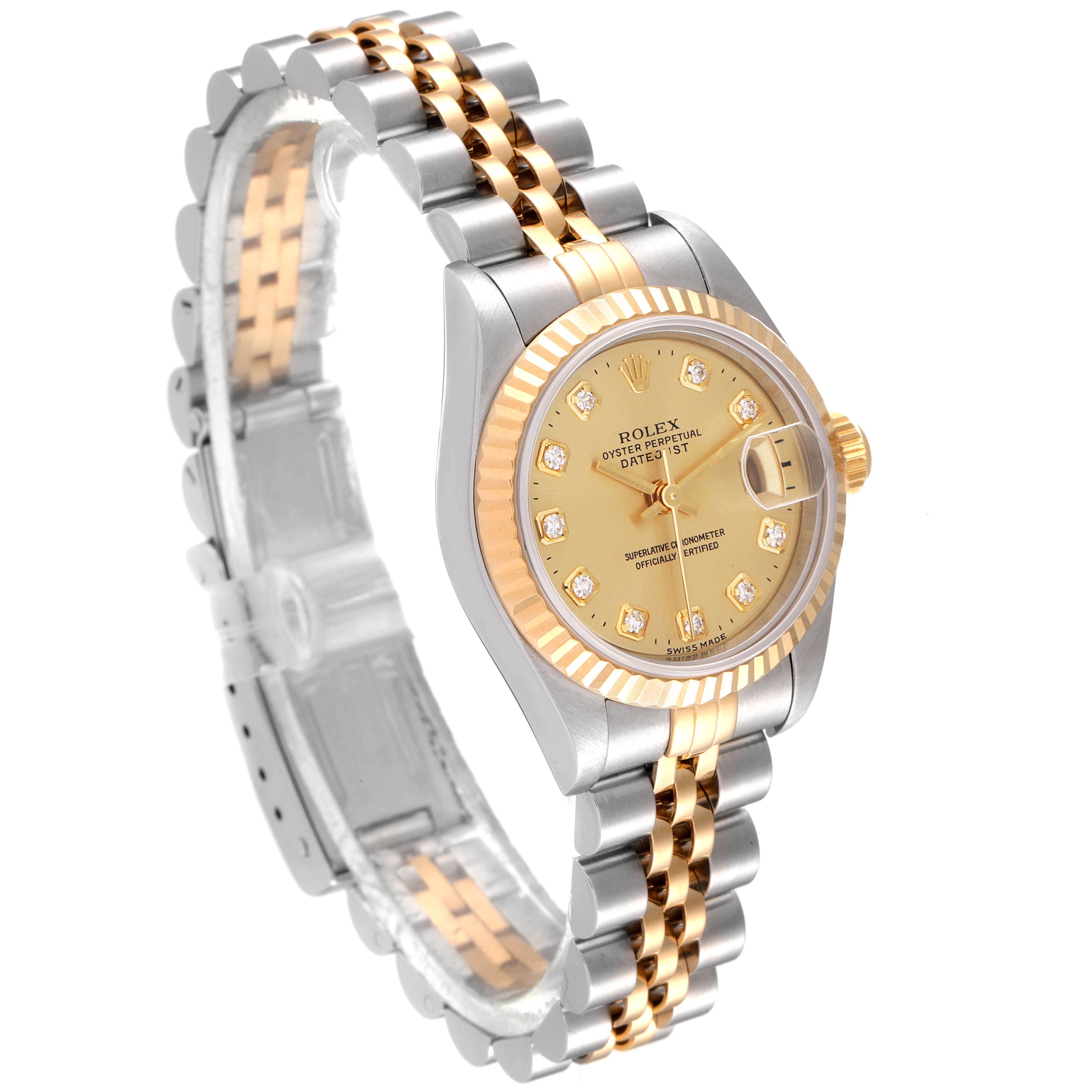 The image shows a Rolex Datejust 69173 Women
s Steel and Gold (two tone) Champagne Dial 69173 Women
s Steel and Gold (two tone) Champagne Dial watch at a three-quarter angle, highlighting its dial, fluted bezel, and two-tone bracelet.