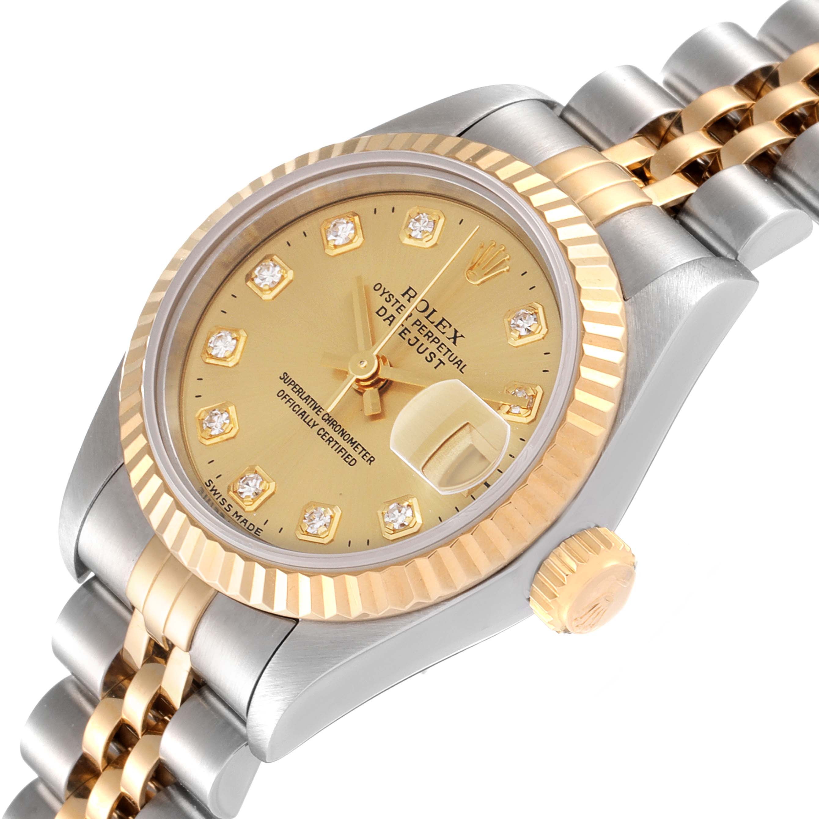 The image showcases an angled view of the Rolex Datejust 69173 Women
s Steel and Gold (two tone) Champagne Dial 69173 Women
s Steel and Gold (two tone) Champagne Dial watch, highlighting the bezel, dial, crown, and two-tone bracelet.