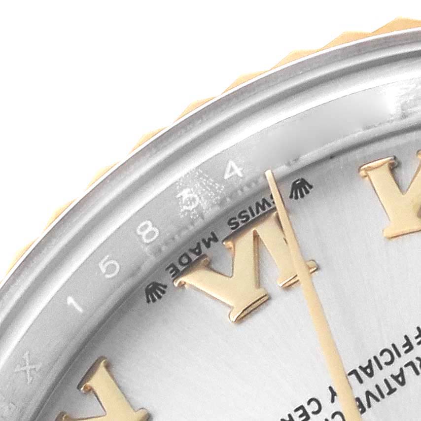 The image shows part of the dial and bezel of the Rolex Datejust 279173 Women's Steel and Gold (two tone) Silver Dial 279173 Women's Steel and Gold (two tone) Silver Dial watch at an angle, highlighting the Roman numerals and minute markers.