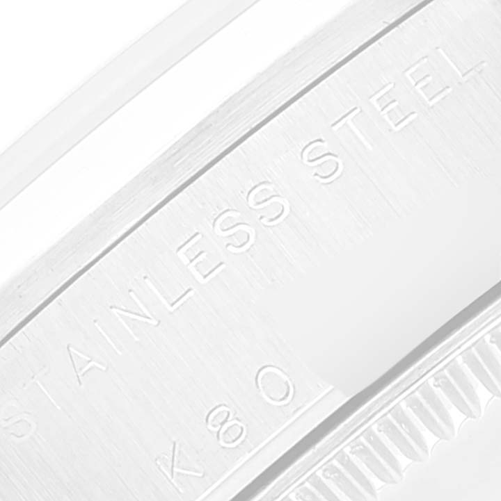 The image shows a close-up of the stainless steel case back of a Mid-Size Rolex watch.