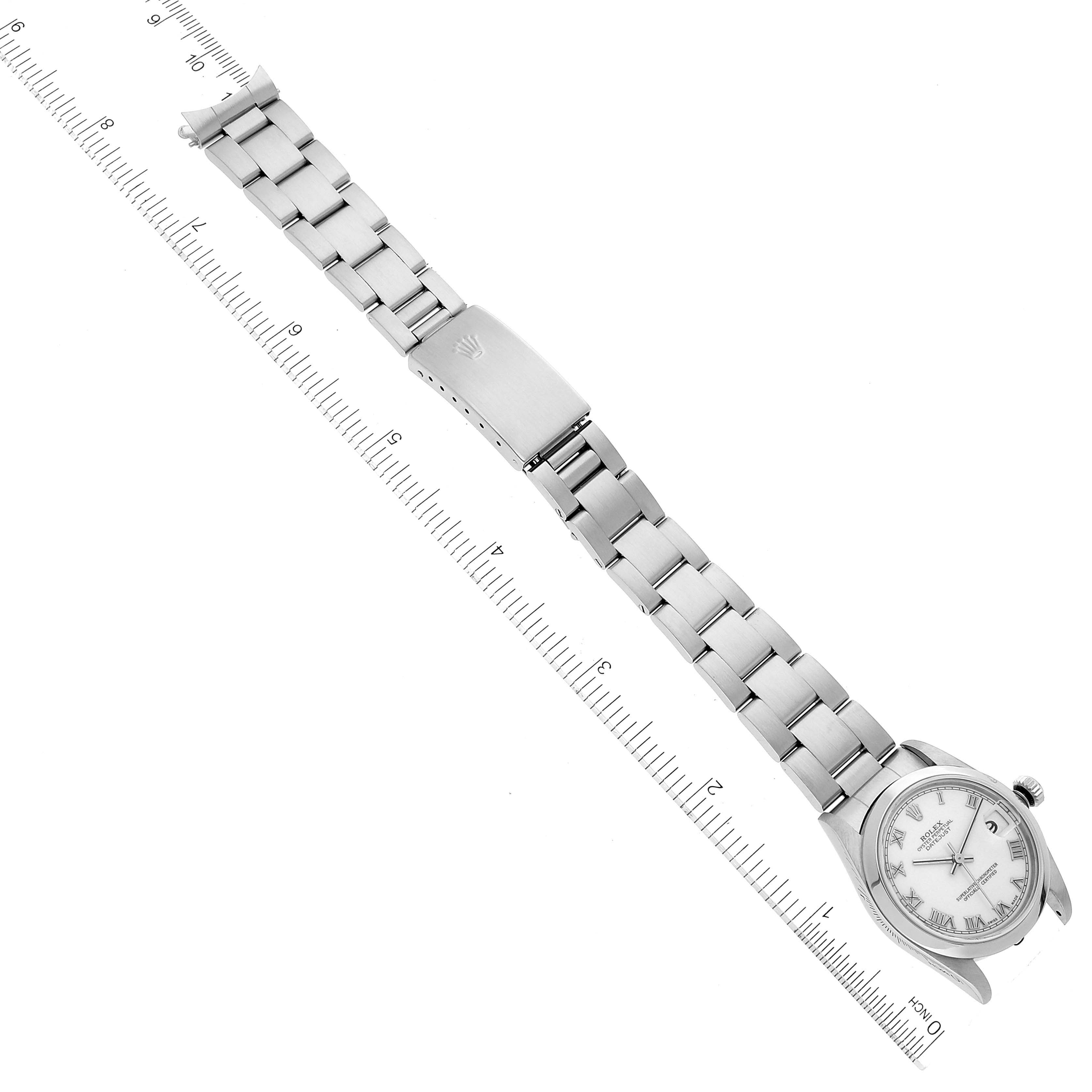 The Rolex Mid-Size 78240 Women
s Stainless Steel White Dial 78240 Women
s Stainless Steel White Dial watch is shown fully extended, with a visible band, clasp, and face displayed from a top-down angle.