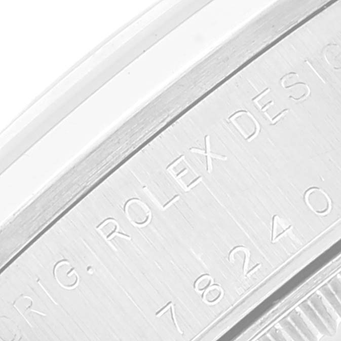 The image shows a close-up of the case side engraving on a Mid-Size Rolex watch.