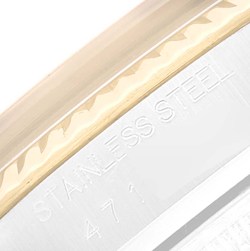 Close-up of the side of the bezel and case back of a Rolex Datejust 16013 Men's Steel and Gold (two tone) Champagne Dial 16013 Men's Steel and Gold (two tone) Champagne Dial, showing the "STAINLESS STEEL" inscription.