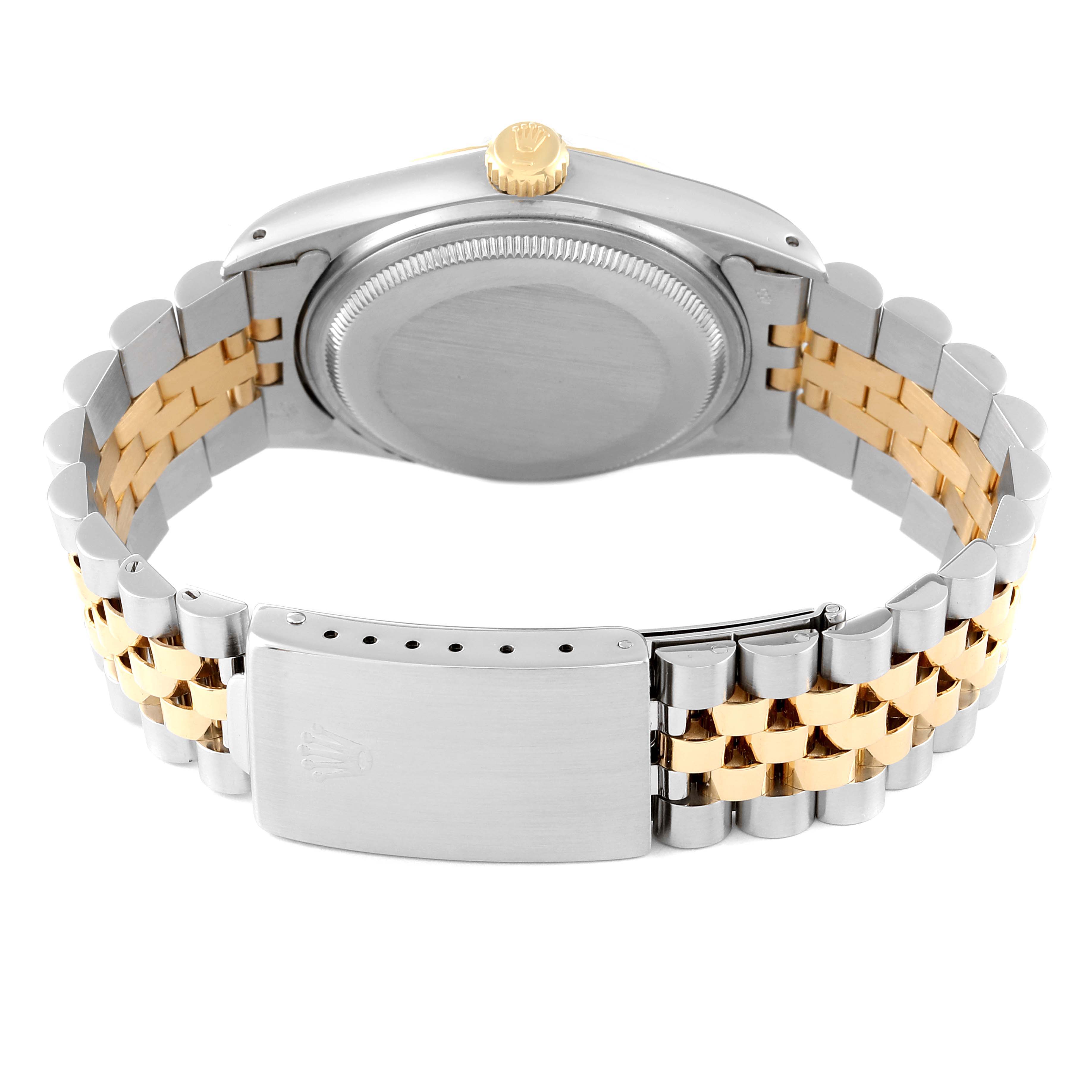 The image shows the back view of a Rolex Datejust 16013 Men's Steel and Gold (two tone) Champagne Dial 16013 Men's Steel and Gold (two tone) Champagne Dial watch, highlighting its case back, crown, and two-tone jubilee bracelet with clasp.