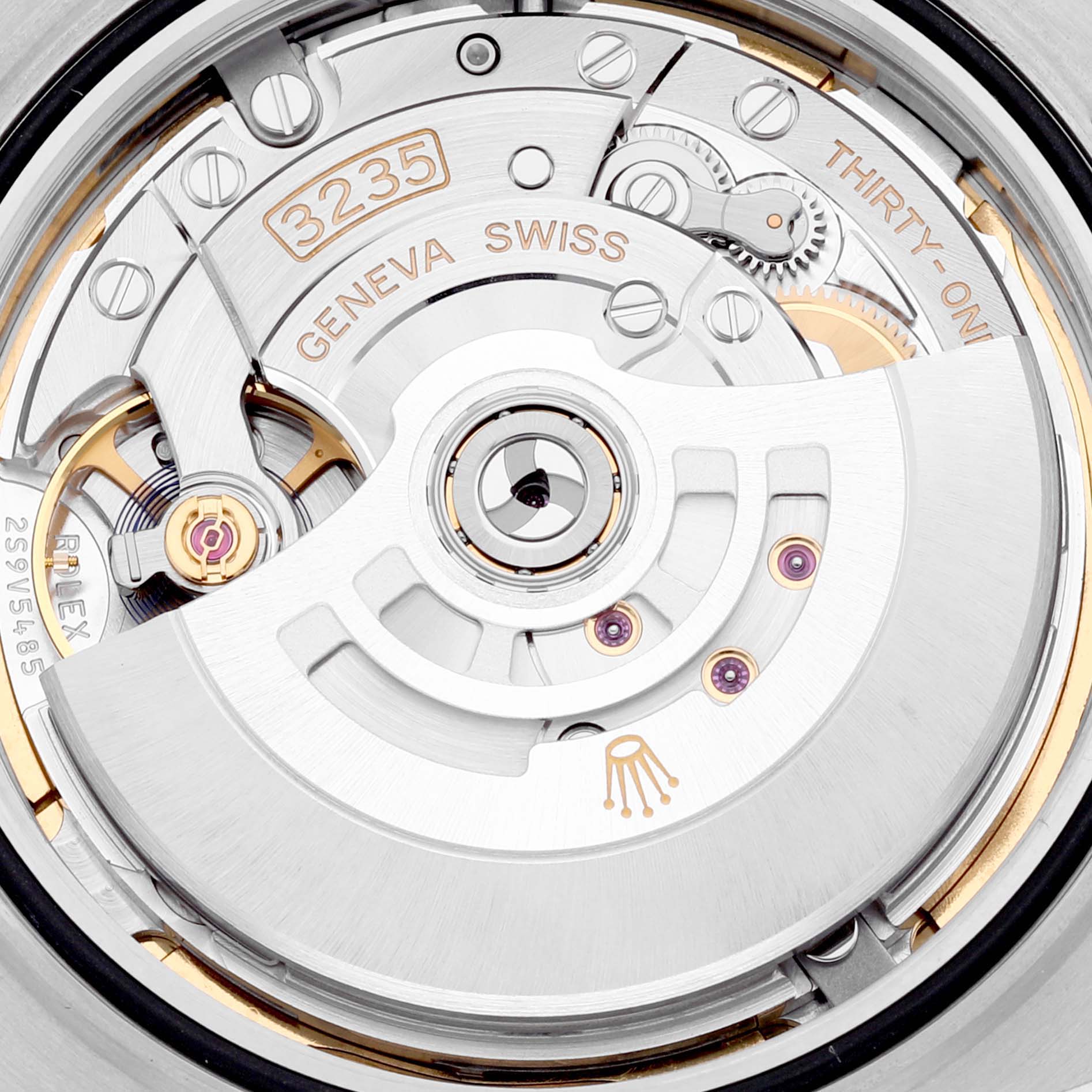 This image shows a close-up of the movement mechanism inside a Rolex Datejust 41 126331 Men's Steel and Gold (two tone) Brown Dial 126331 Men's Steel and Gold (two tone) Brown Dial watch, including gears, screws, and the rotor.