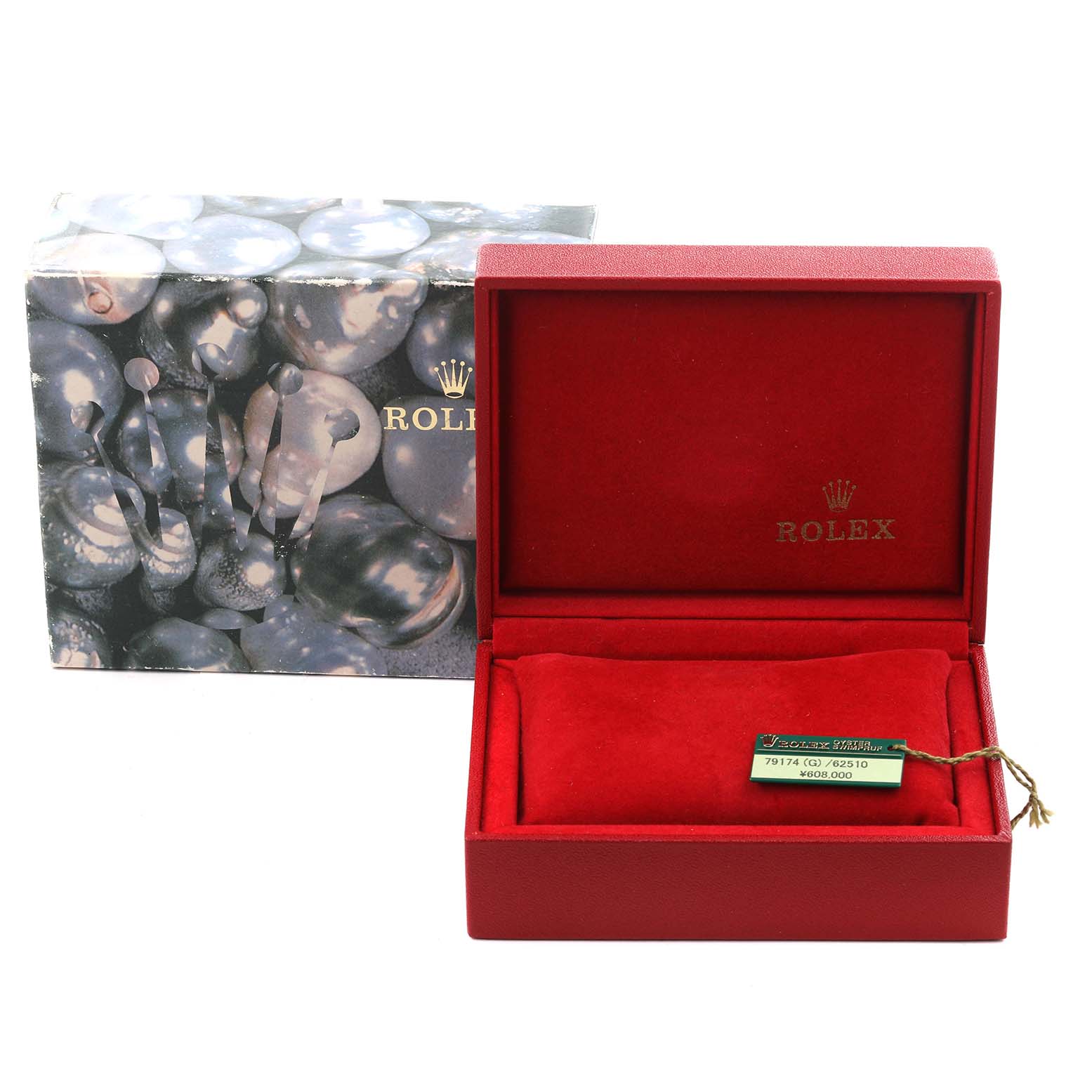 The image shows the Rolex Datejust 79174 Women's Stainless Steel Blue Dial 79174 Women's Stainless Steel Blue Dial box with its outer case and a tag, angled to display the interior.