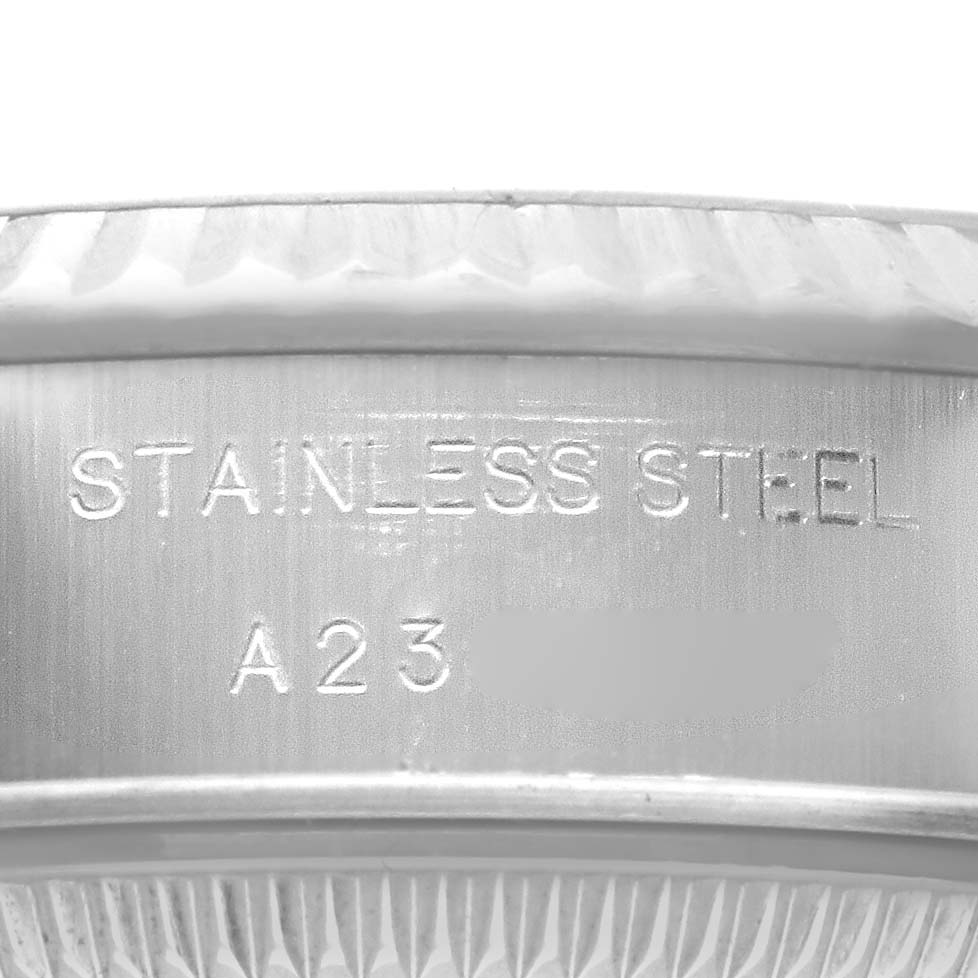 The image shows the inner side of the Rolex Datejust 79174 Women's Stainless Steel Blue Dial 79174 Women's Stainless Steel Blue Dial bezel with "STAINLESS STEEL" engraved.