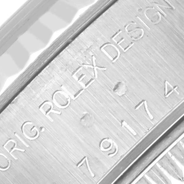 The image shows the side engraving of a Rolex Datejust 79174 Women's Steel and Gold (two tone) Blue Dial 79174 Women's Steel and Gold (two tone) Blue Dial, highlighting the model number and design details.