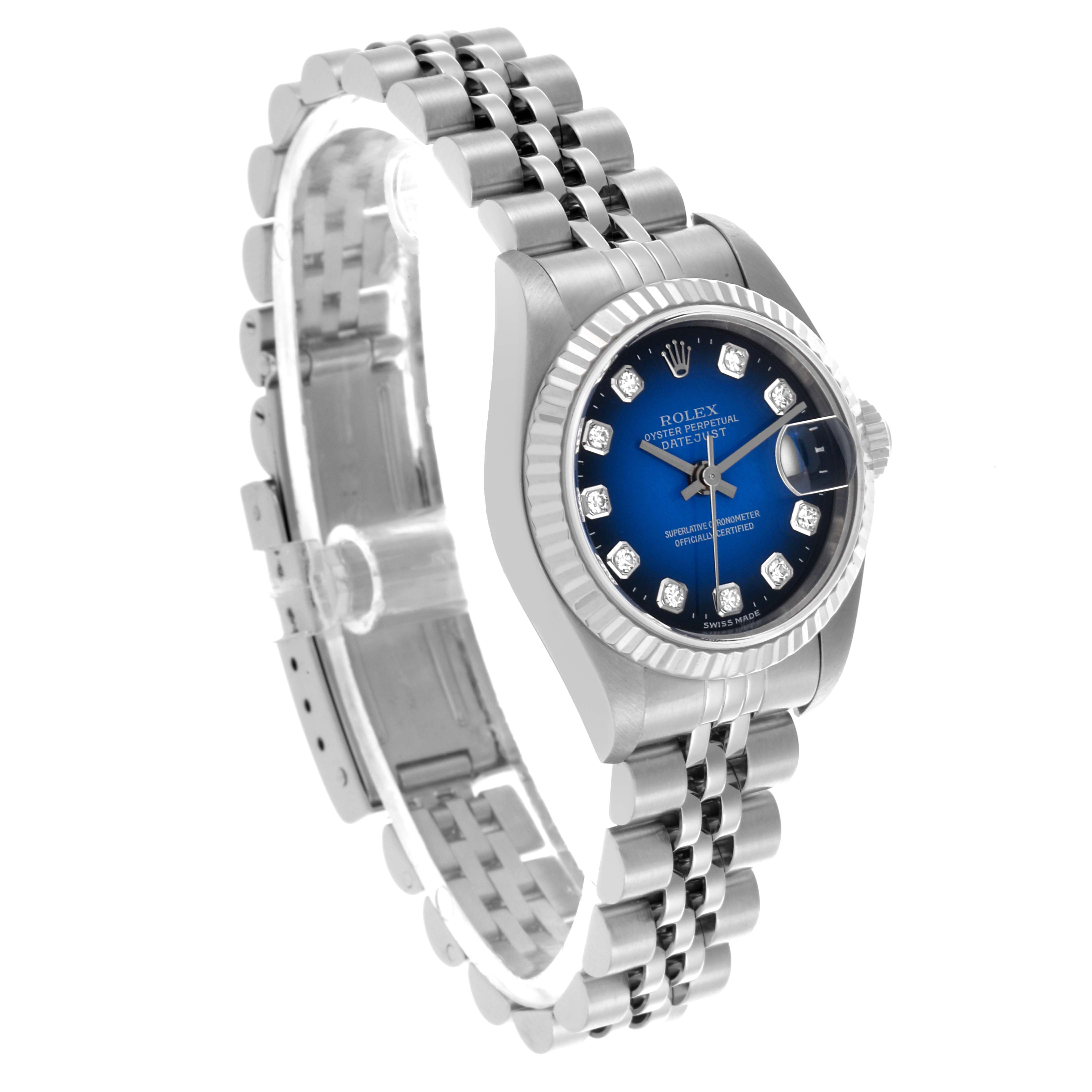 The Rolex Datejust 79174 Women's Steel and Gold (two tone) Blue Dial 79174 Women's Steel and Gold (two tone) Blue Dial watch is shown at a 3/4 angle highlighting the blue dial, fluted bezel, and Jubilee bracelet.
