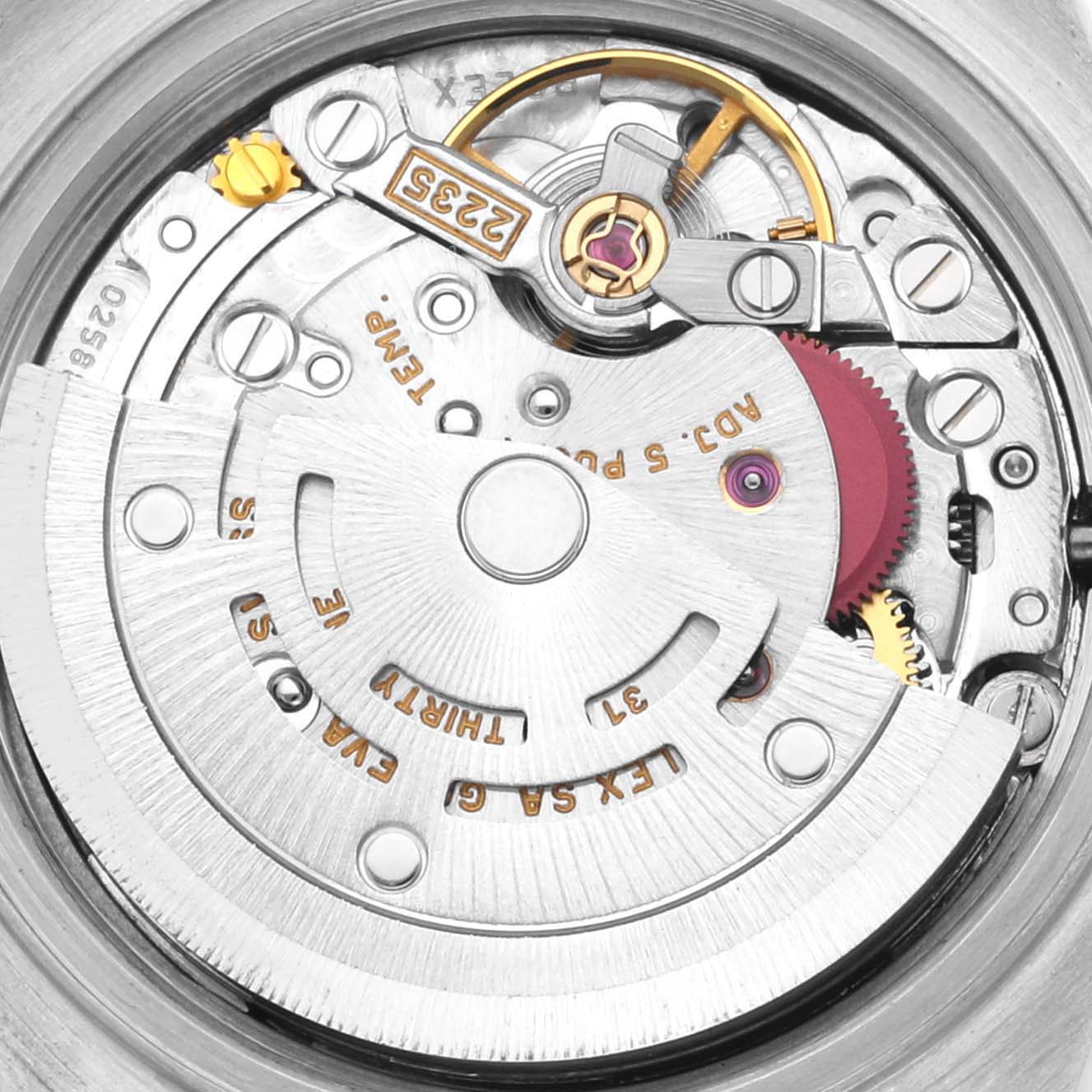 The image shows a close-up of the movement inside a Rolex Datejust 79174 Women's Steel and Gold (two tone) Blue Dial 79174 Women's Steel and Gold (two tone) Blue Dial, highlighting its intricate mechanical parts.