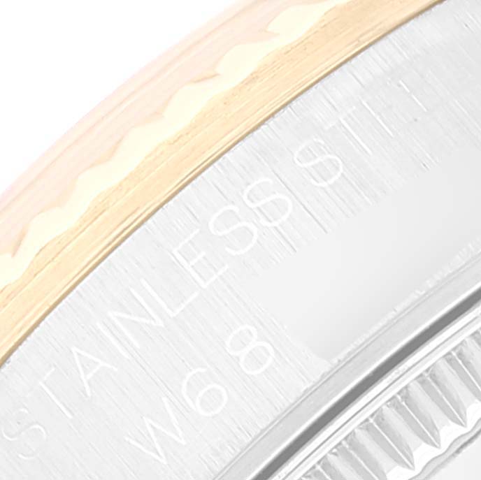 The image shows a close-up of the side and bezel of a Rolex Datejust 68273 Women's Steel and Gold (two tone) White Dial 68273 Women's Steel and Gold (two tone) White Dial watch, highlighting the "STAINLESS STEEL" engraving.
