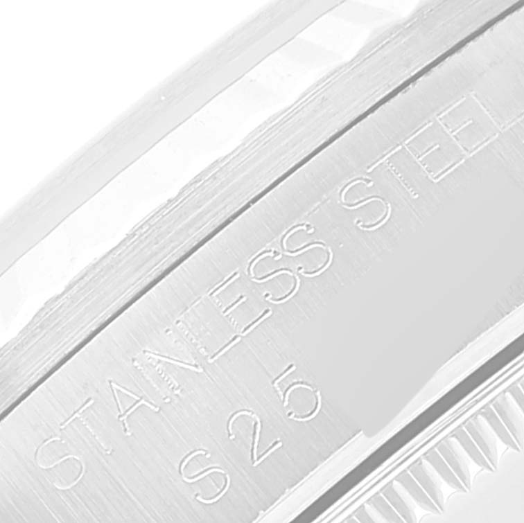 This image shows a close-up of the engraved stainless steel side of a Rolex Mid-Size 68274 Women
s Stainless Steel Pink Dial 68274 Women
s Stainless Steel Pink Dial watch bezel.