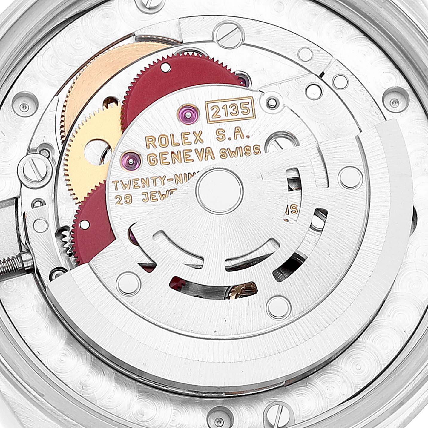 This image shows a close-up of the movement inside a Mid-Size Rolex watch, highlighting its intricate internal components.