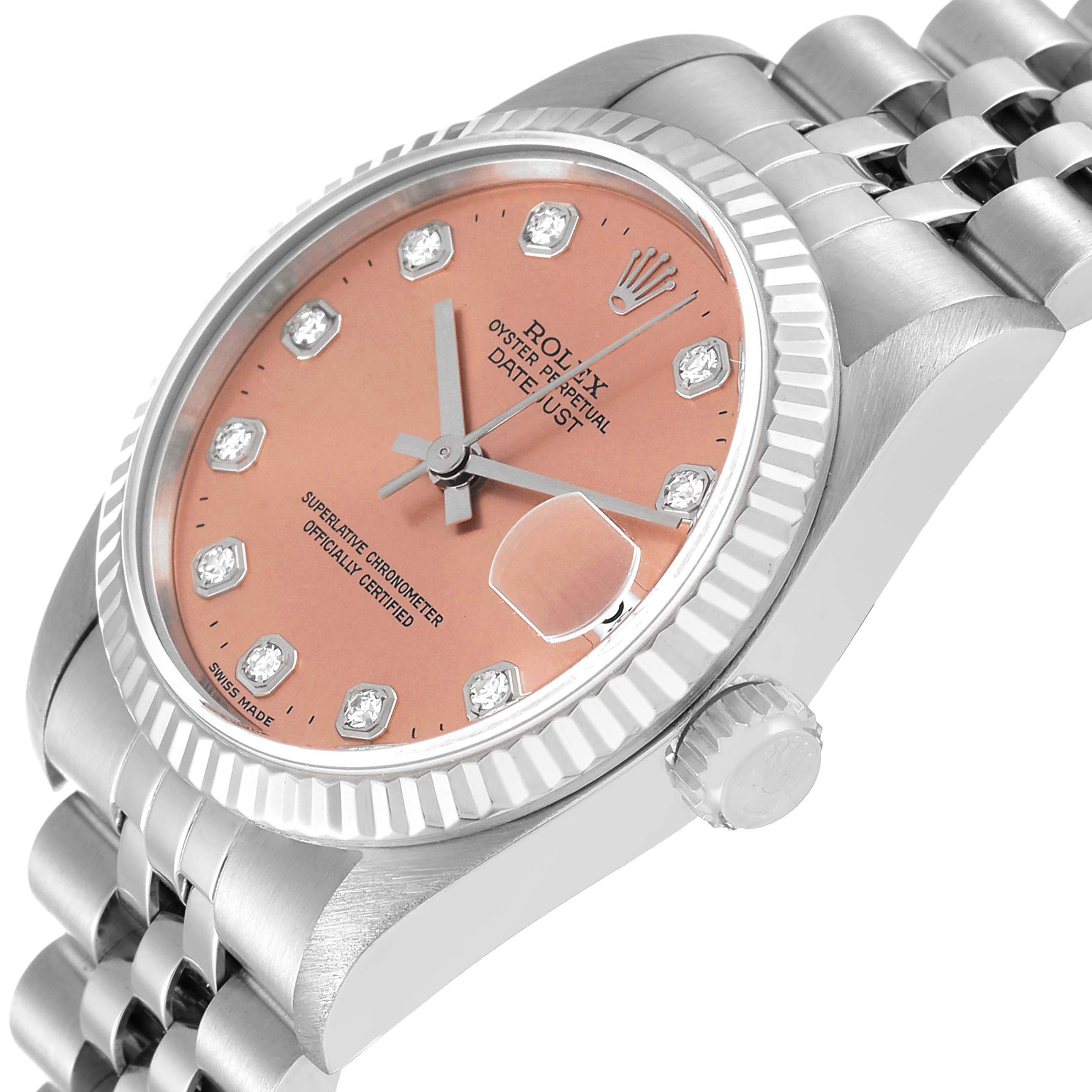 This image shows a side-angle view of a Rolex Mid-Size 68274 Women
s Stainless Steel Pink Dial 68274 Women
s Stainless Steel Pink Dial Datejust watch highlighting its pink face, fluted bezel, crown, and bracelet.