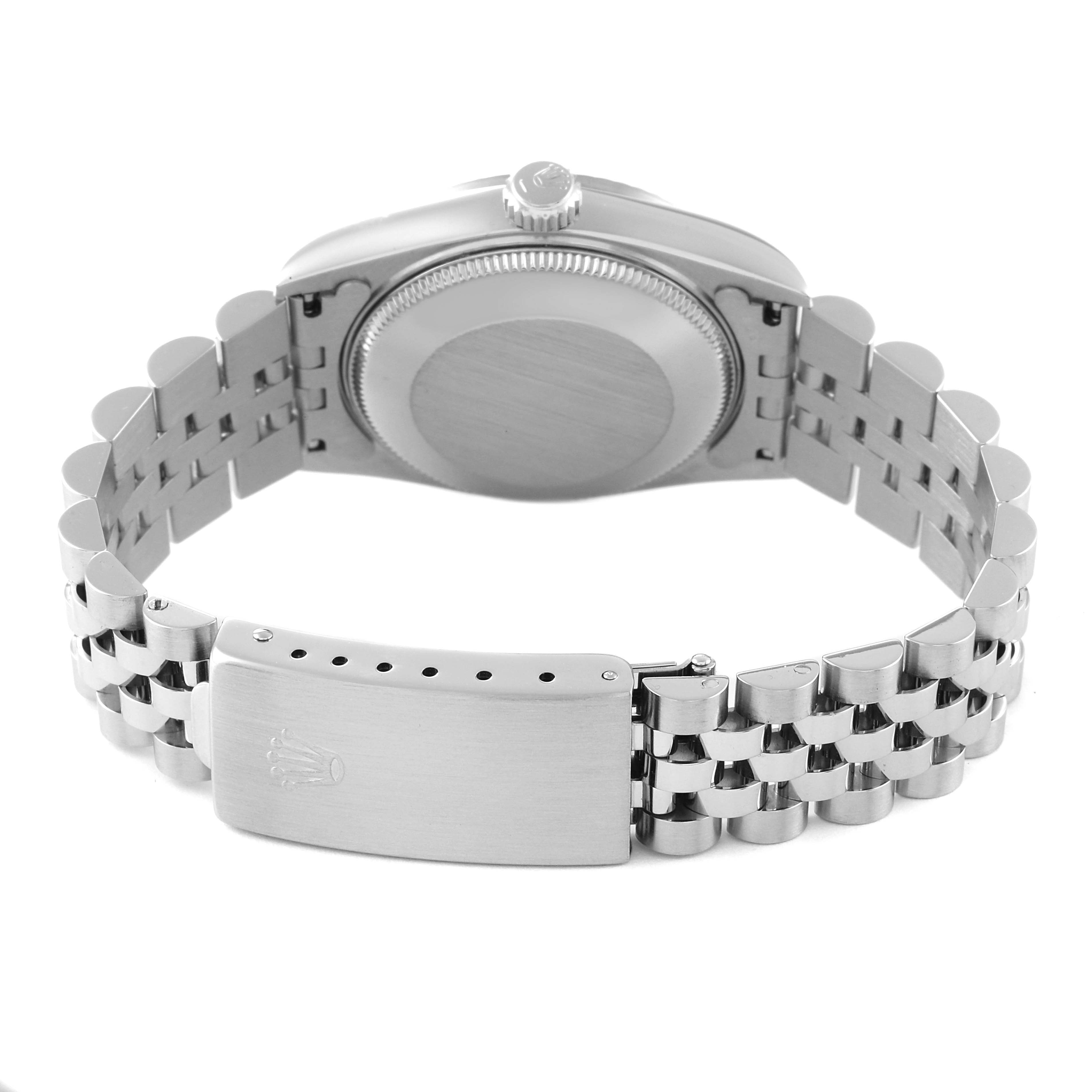 The image shows the back view of a Rolex Mid-Size 68274 Women
s Stainless Steel Pink Dial 68274 Women
s Stainless Steel Pink Dial watch, focusing on the case back and partially open bracelet clasp.