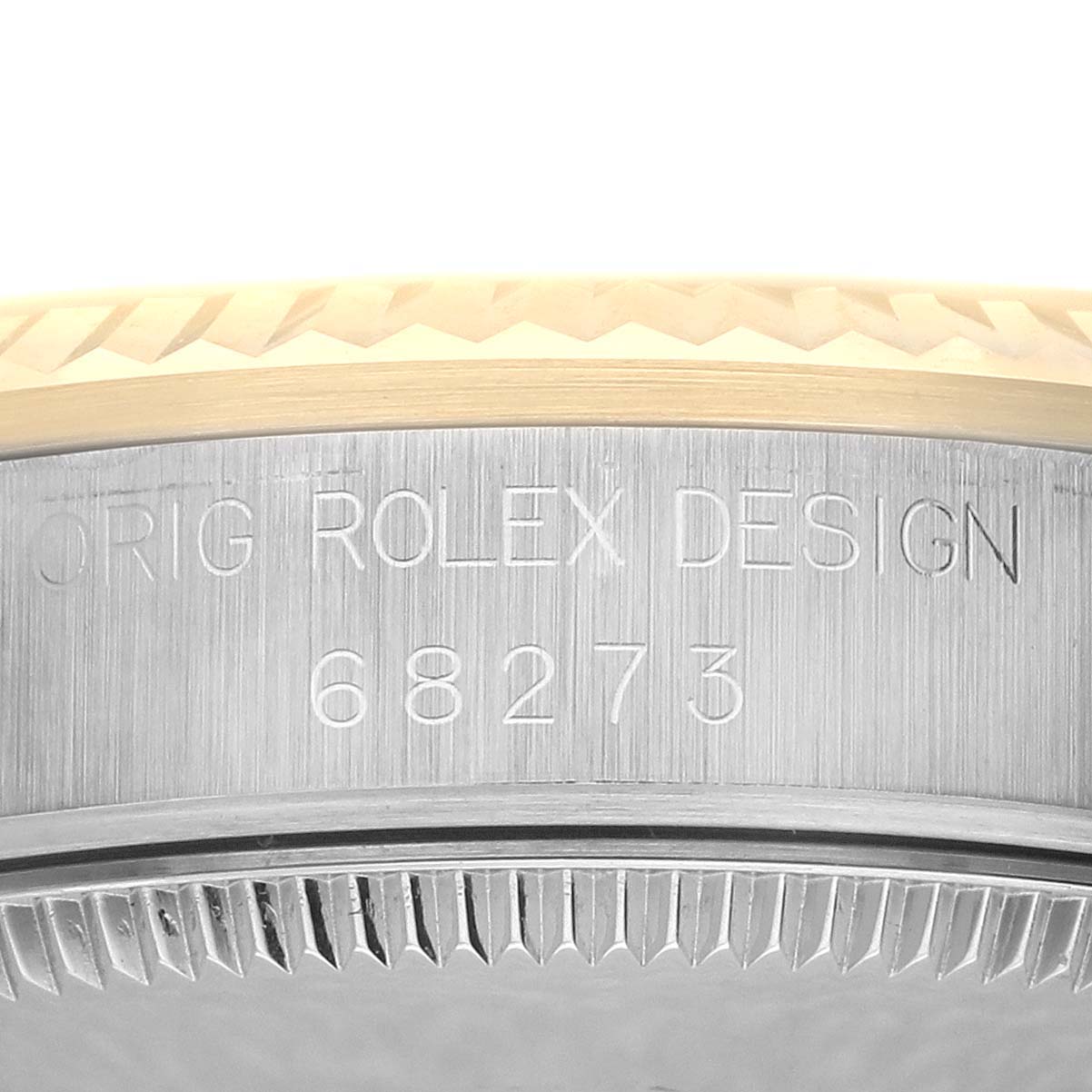 The image shows a close-up of the Rolex Mid-Size 68273 Women's Steel and Gold (two tone) Champagne Dial 68273 Women's Steel and Gold (two tone) Champagne Dial case side with model number 68273 engraved.