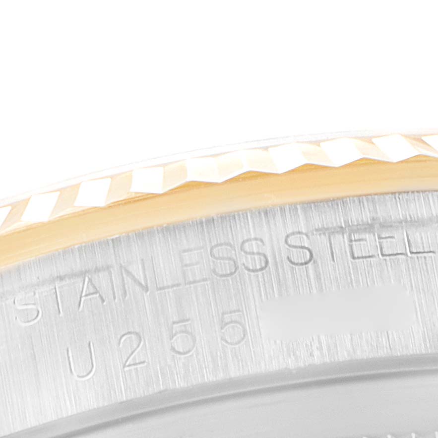 The image shows a close-up of the bezel and case side of a Rolex Datejust 16233 Men
s Steel and Gold (two tone) Silver Dial 16233 Men
s Steel and Gold (two tone) Silver Dial watch with "STAINLESS STEEL" engraving.