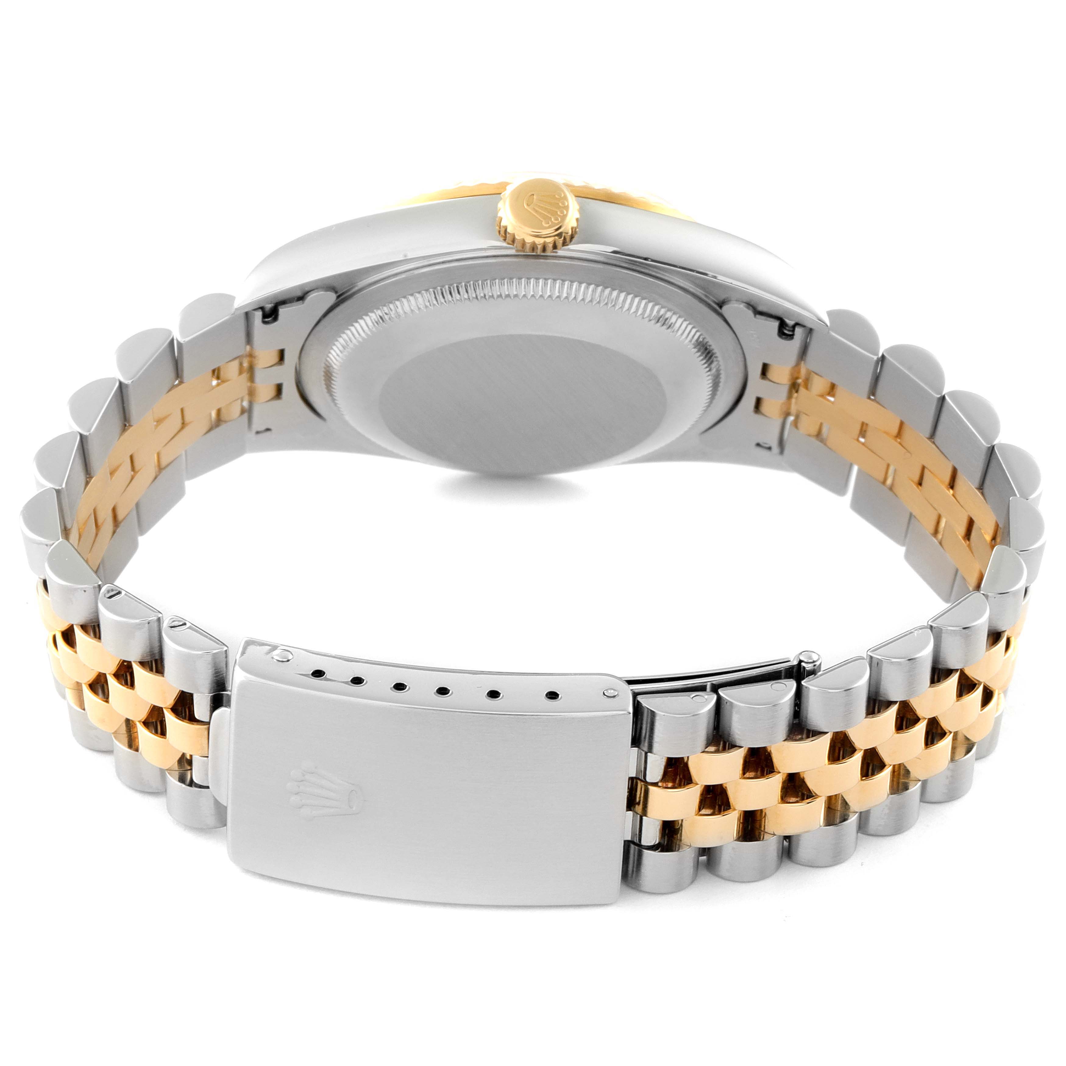 This image features the back view of a Rolex Datejust 16233 Men
s Steel and Gold (two tone) Silver Dial 16233 Men
s Steel and Gold (two tone) Silver Dial watch, highlighting its two-tone bracelet, clasp, and case back.