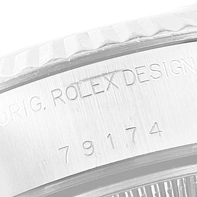 This image shows a close-up of the engraving and bezel on a Rolex Datejust 79174 Women's Stainless Steel Mother of Pearl Dial 79174 Women's Stainless Steel Mother of Pearl Dial model.