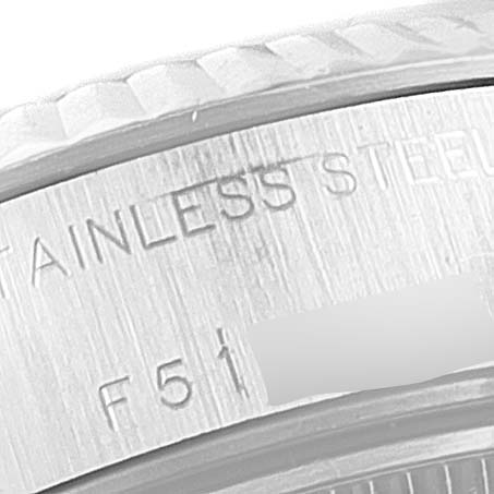The image shows a close-up of the rim and part of the case back of a Rolex Datejust 79174 Women's Stainless Steel Mother of Pearl Dial 79174 Women's Stainless Steel Mother of Pearl Dial watch, highlighting "STAINLESS STEEL" and partial serial number.