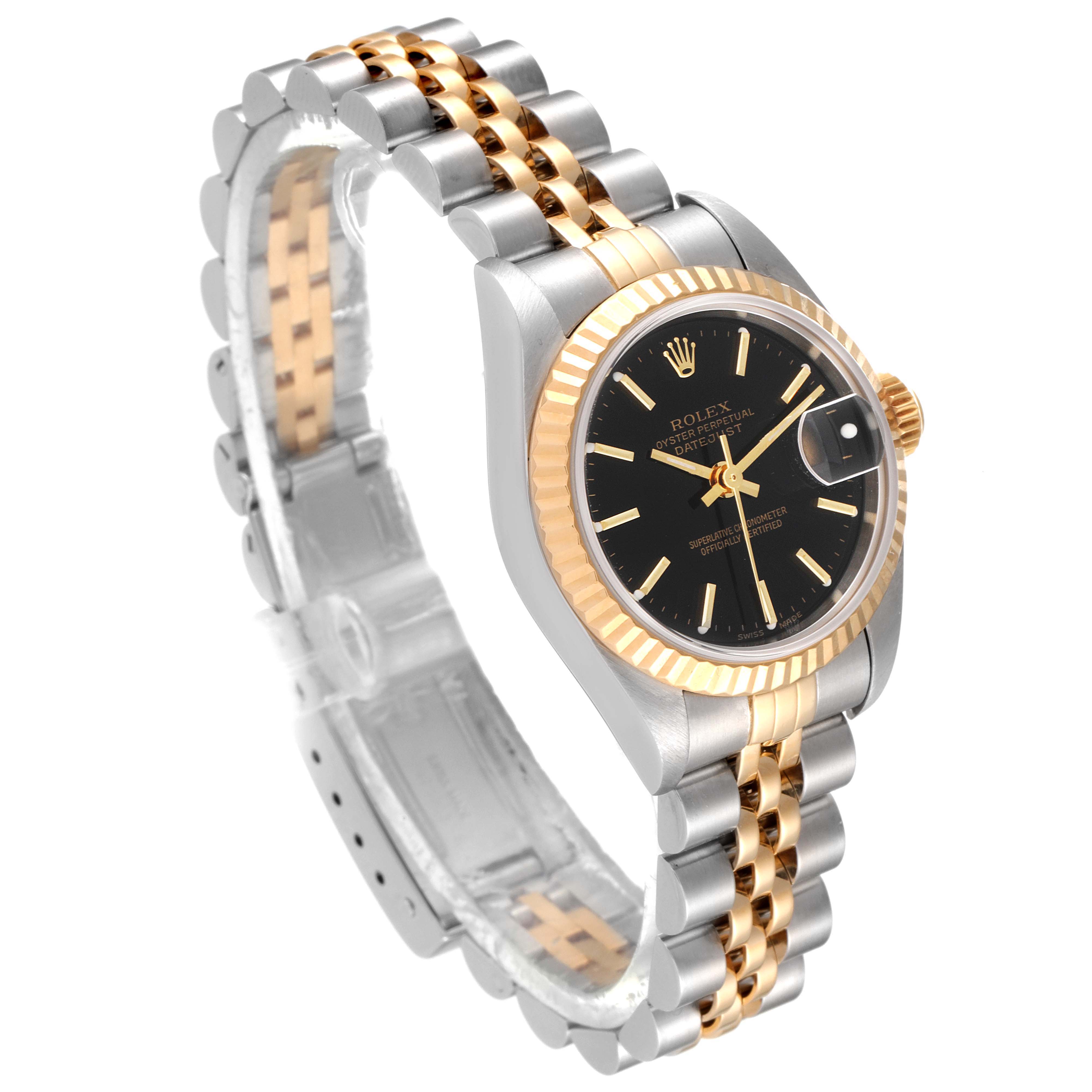 The image shows a Rolex Datejust 79173 Women's Steel and Gold (two tone) Black Dial 79173 Women's Steel and Gold (two tone) Black Dial watch at a three-quarter angle, displaying the face, bezel, and two-tone bracelet.