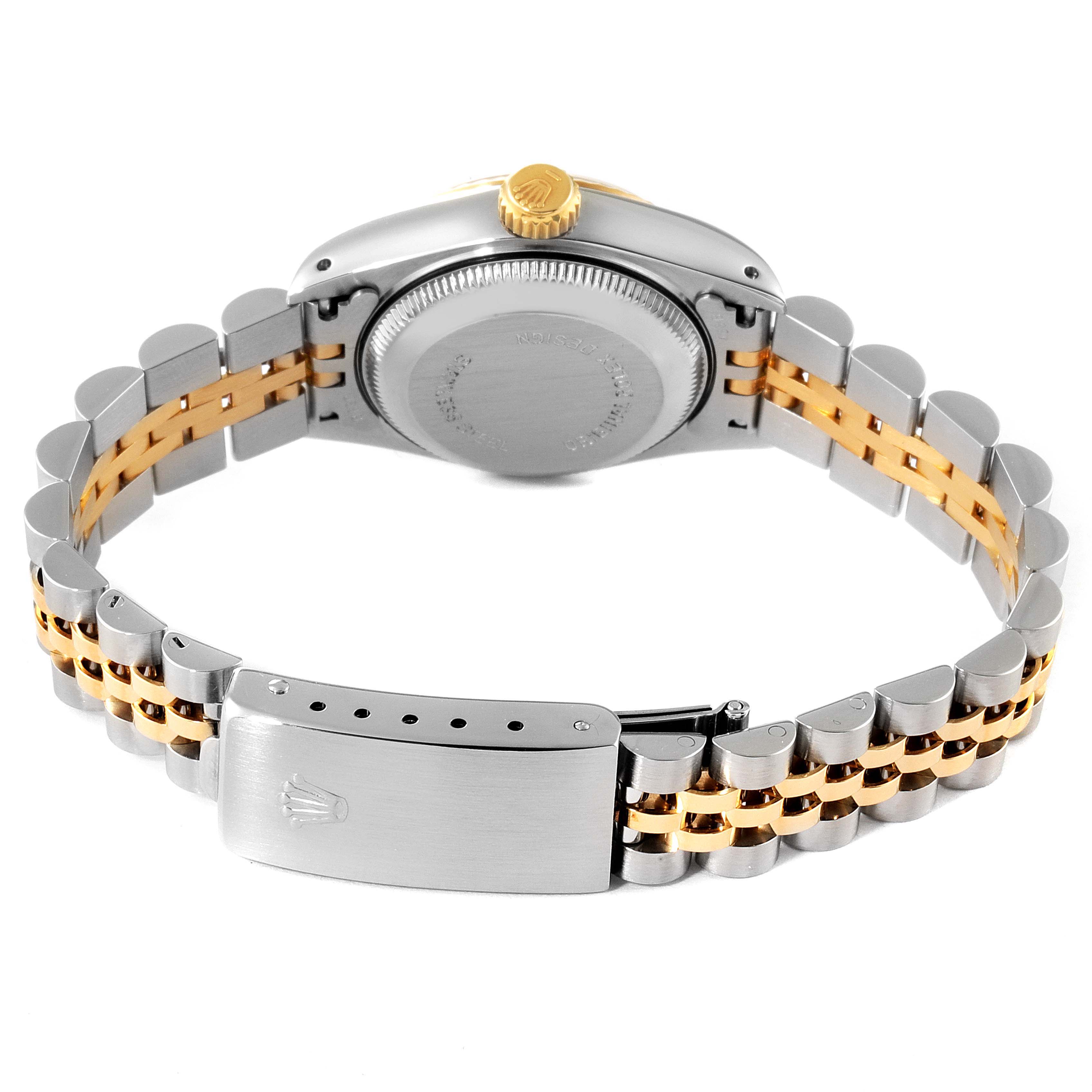 The image shows the back case and the two-tone metal bracelet of a Rolex Datejust 69173 Women
s Steel and Gold (two tone) Champagne Dial 69173 Women
s Steel and Gold (two tone) Champagne Dial watch.