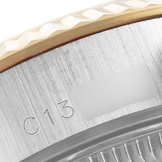 This image shows a close-up of the caseback and edge of the bezel of a Rolex Datejust 69173 Women
s Steel and Gold (two tone) Champagne Dial 69173 Women
s Steel and Gold (two tone) Champagne Dial watch.