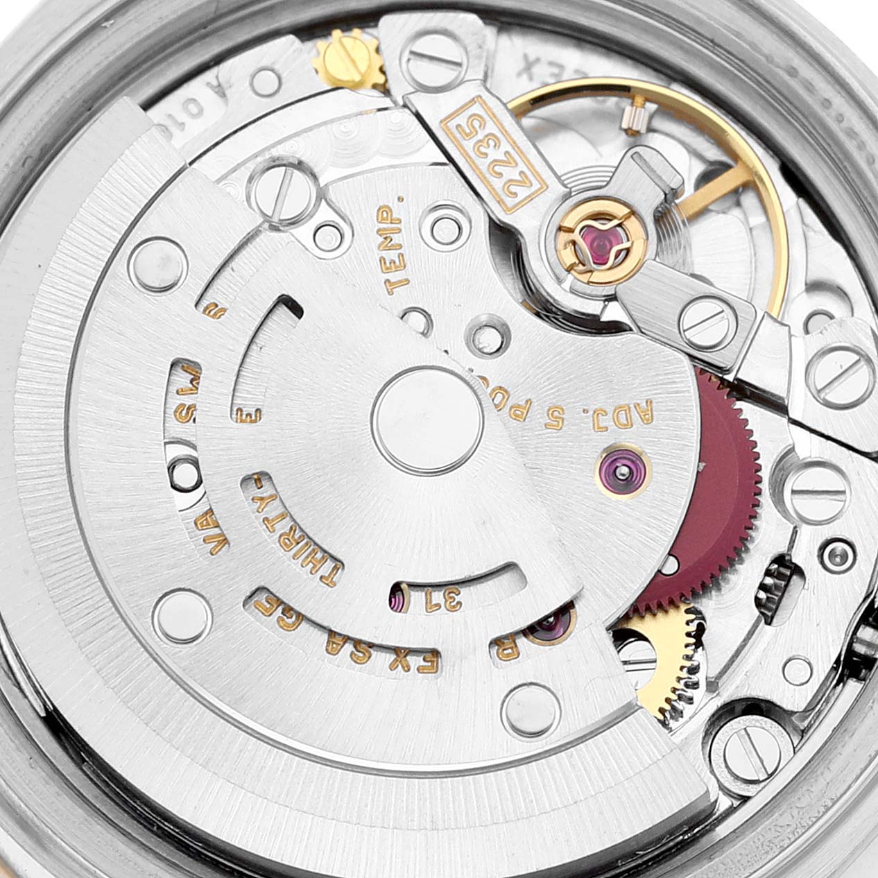 This image shows a close-up view of the movement mechanism in a Rolex Datejust 79163 Women's Steel and Gold (two tone) White Dial 79163 Women's Steel and Gold (two tone) White Dial watch.