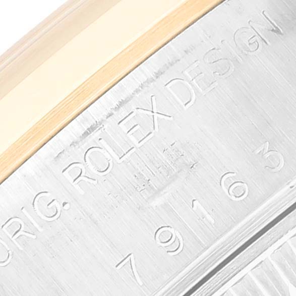 This image shows a close-up of the engraved model number and "ORIG. ROLEX DESIGN" text on the metal case of a Rolex Datejust 79163 Women's Steel and Gold (two tone) White Dial 79163 Women's Steel and Gold (two tone) White Dial watch.