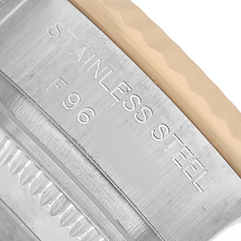 The image shows a close-up of the side engraving on the stainless steel case of a Rolex Datejust 179173 Women's Steel and Gold (two tone) White Dial watch.