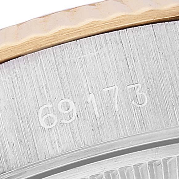 The image shows a close-up of the Rolex Datejust 69173 Women's Steel and Gold (two tone) White Dial 69173 Women's Steel and Gold (two tone) White Dial model, focusing on the edge of the case with the serial number "69173" engraved.