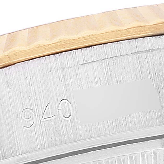 This close-up image shows the side of the bezel and the case with engraved numbers of a Rolex Datejust 69173 Women's Steel and Gold (two tone) White Dial 69173 Women's Steel and Gold (two tone) White Dial watch.