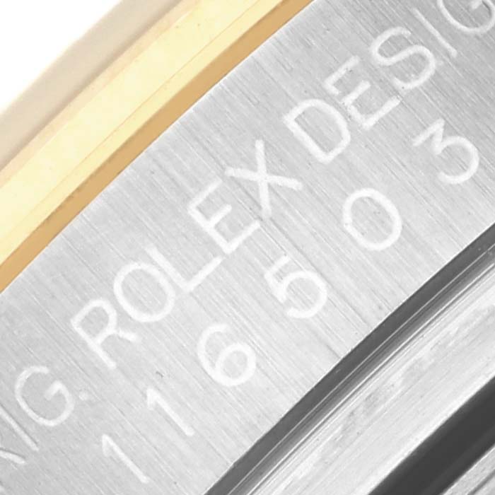 The image shows a close-up of the engraved bezel edge of a Rolex Daytona 116503 Men's Steel and Gold (two tone) Mother of Pearl Dial 116503 Men's Steel and Gold (two tone) Mother of Pearl Dial watch, highlighting the metal texture and model number.