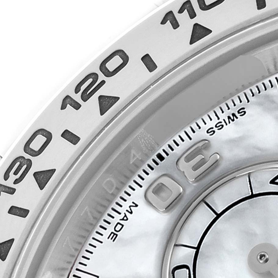 The image shows a close-up of the bezel and part of the dial of a Rolex Daytona 116509NG Men
s White Gold Mother of Pearl Dial watch, highlighting the tachymetric scale.